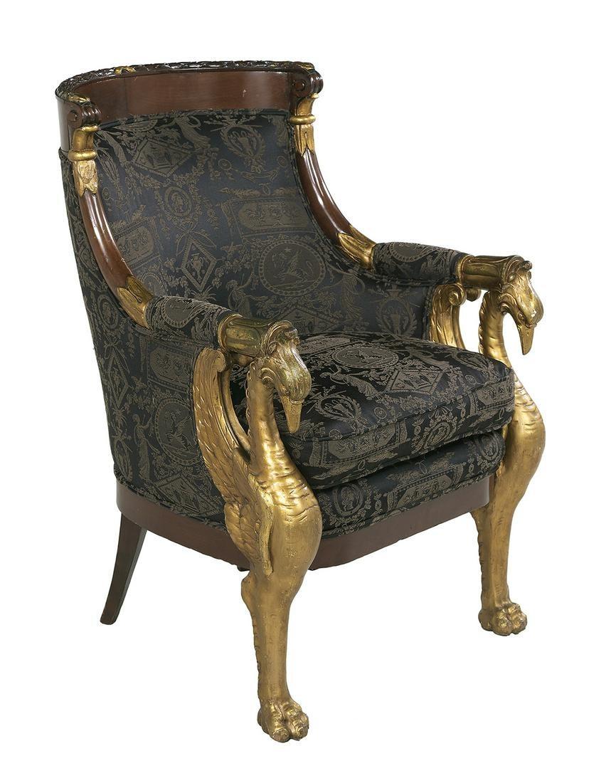 19th century French Empire and parcel gilt bergère. Gilt swan arms and pawed feet.