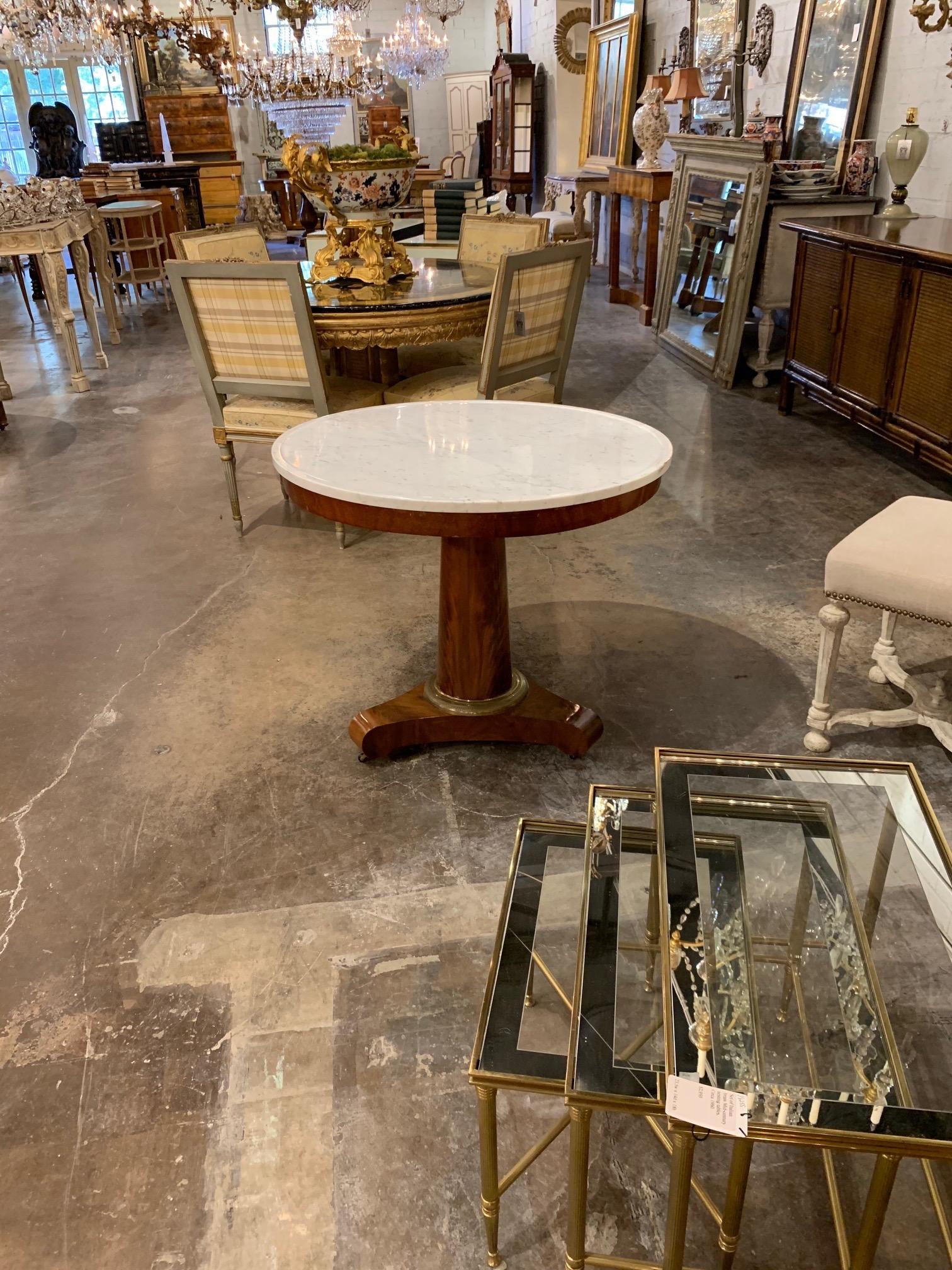Lovely 19th century French Empire mahogany side table with original marble top. The wood base has a beautiful polished look and the marble is gorgeous. Very fine quality!!