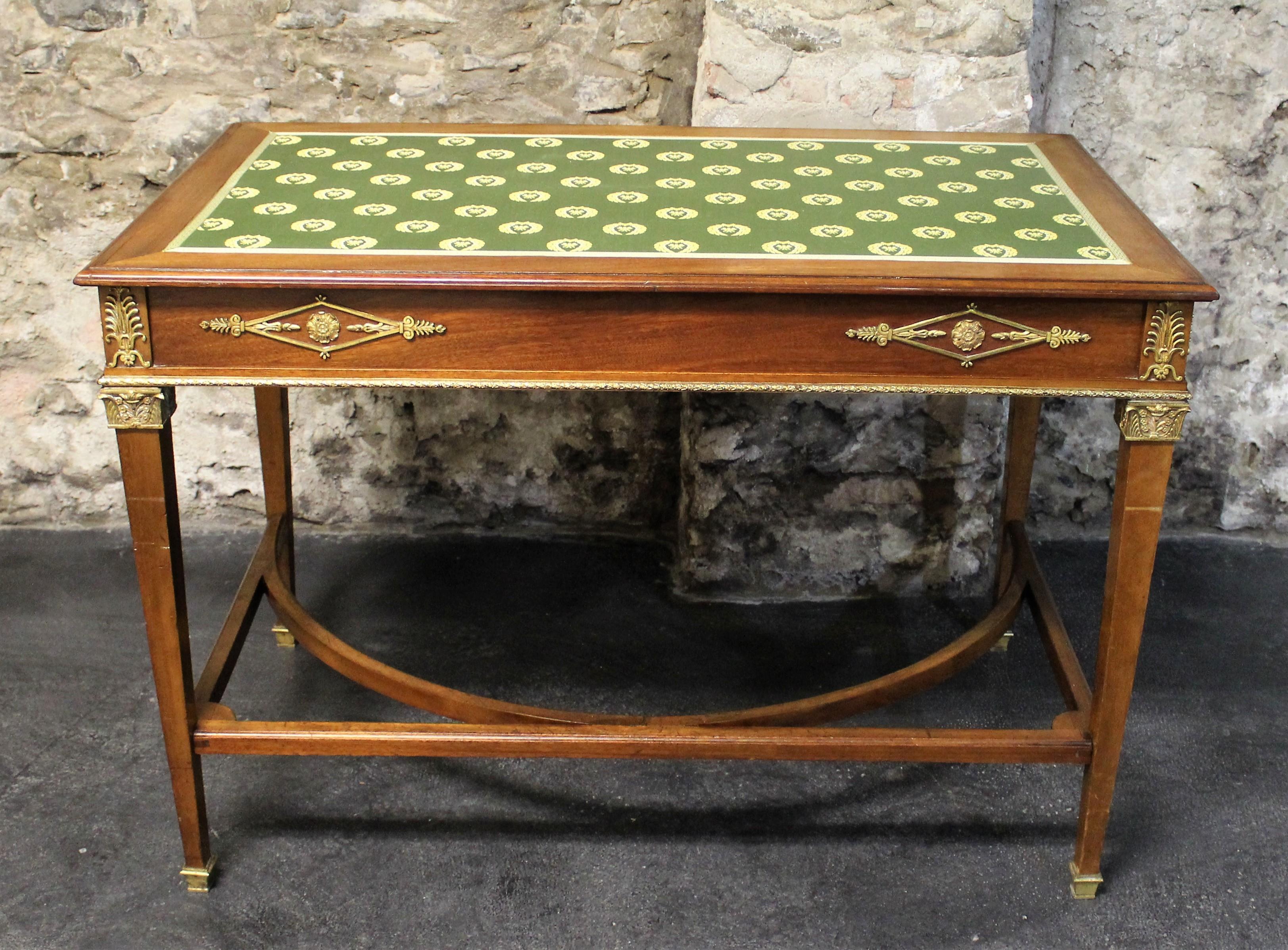 19th century French Empire mahogany two-drawer desk with bronze accents.