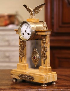 pendule de cheminée Empire du XIXe siècle en marbre et bronze de Bonnet & Pottier