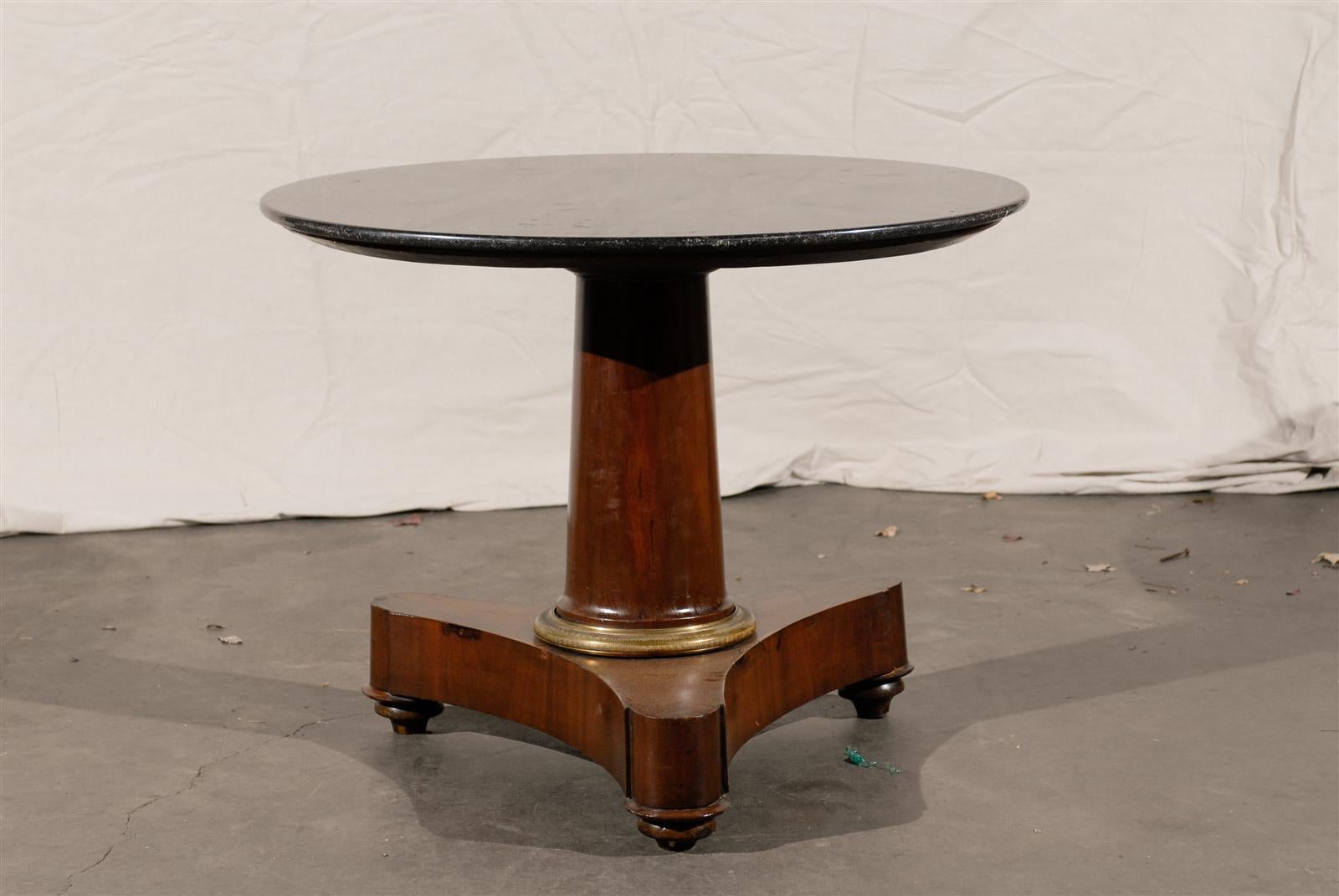 19th century French empire marble-top center table with single column gilt bronze mount.