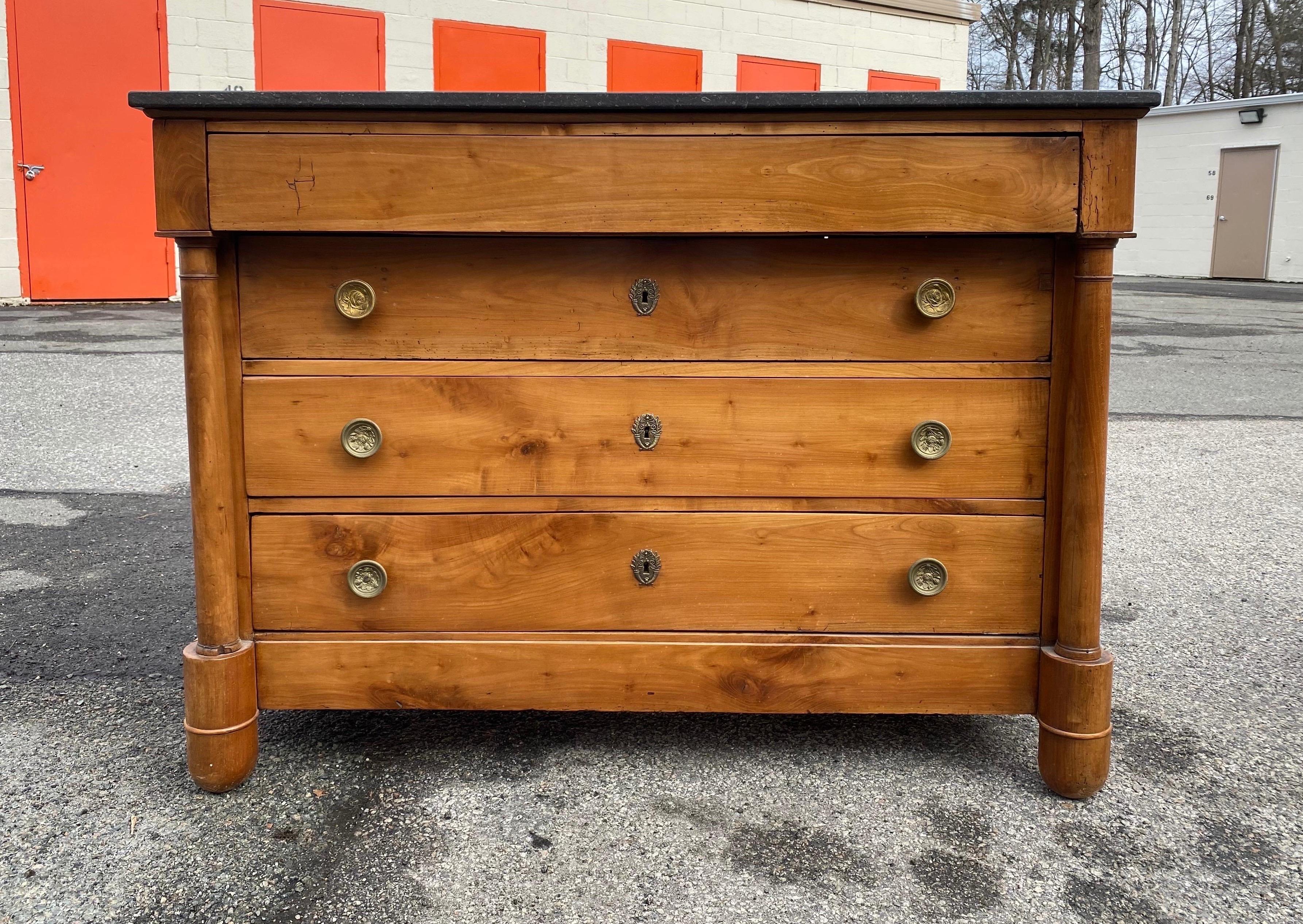 Gorgeous color on this 19th century French Empire four drawer marble top cherry commode.