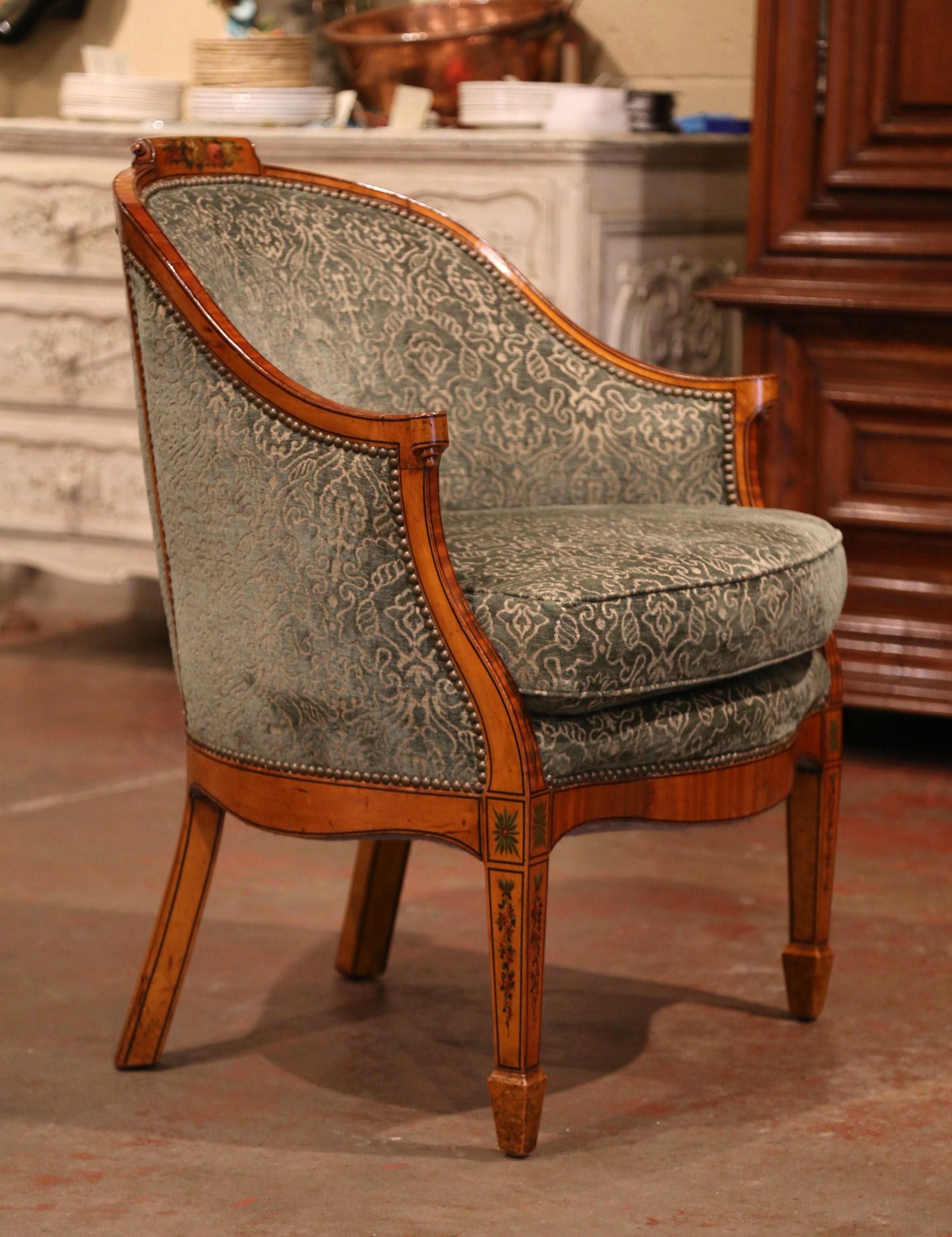 Decorate an office or a study with this elegant antique chair; crafted in France circa 1860, the desk chair features marquetry decor around the frame embellished with hand painted floral motifs. The chair stands on tapered front legs over a bombe
