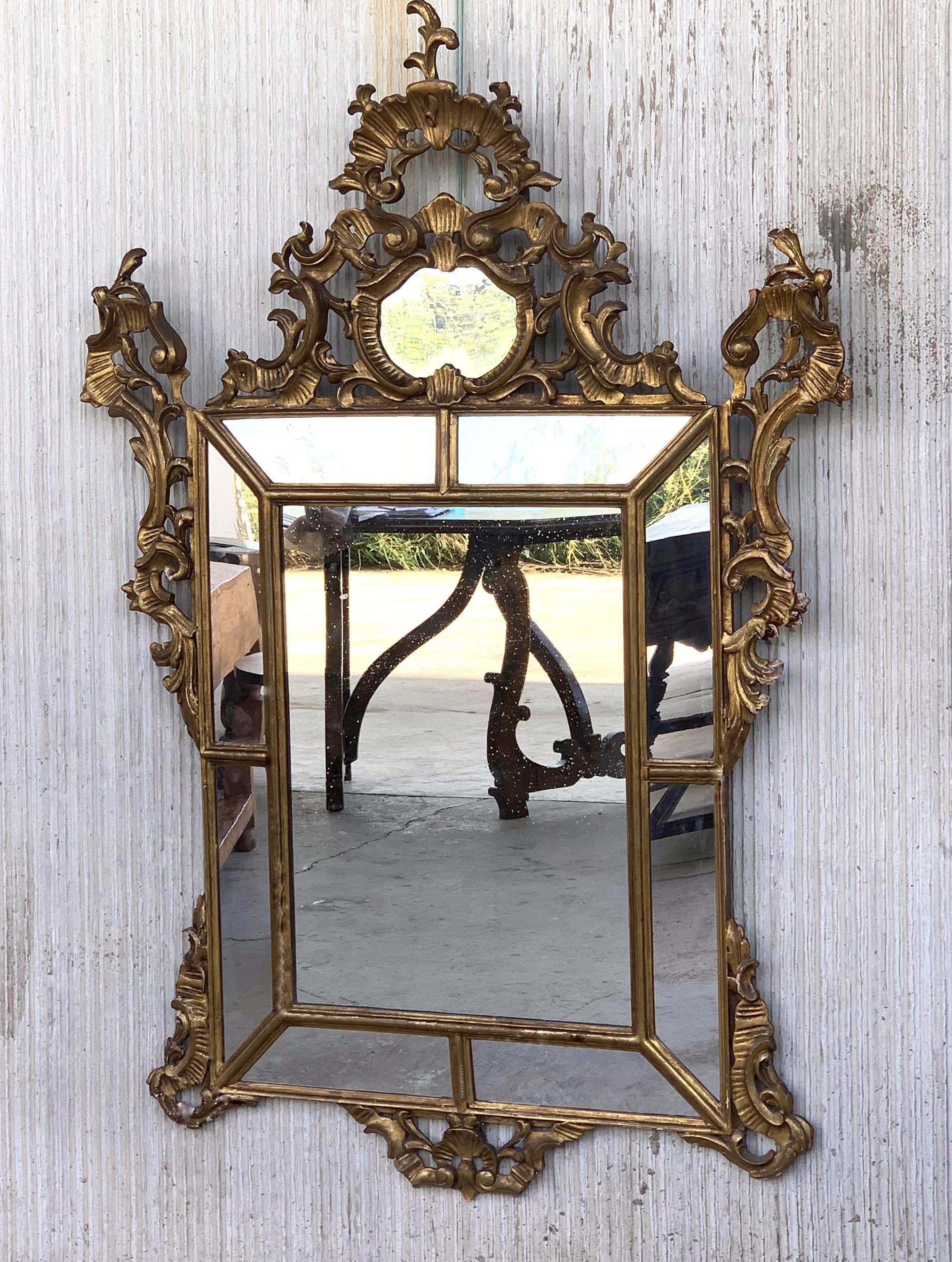 19th century French Empire period carved giltwood rectangular mirror
An exceptional matched hand carved and gilded Italian mirror. Highly carved with flowers, original glass and original wood backs, France, 19th century.