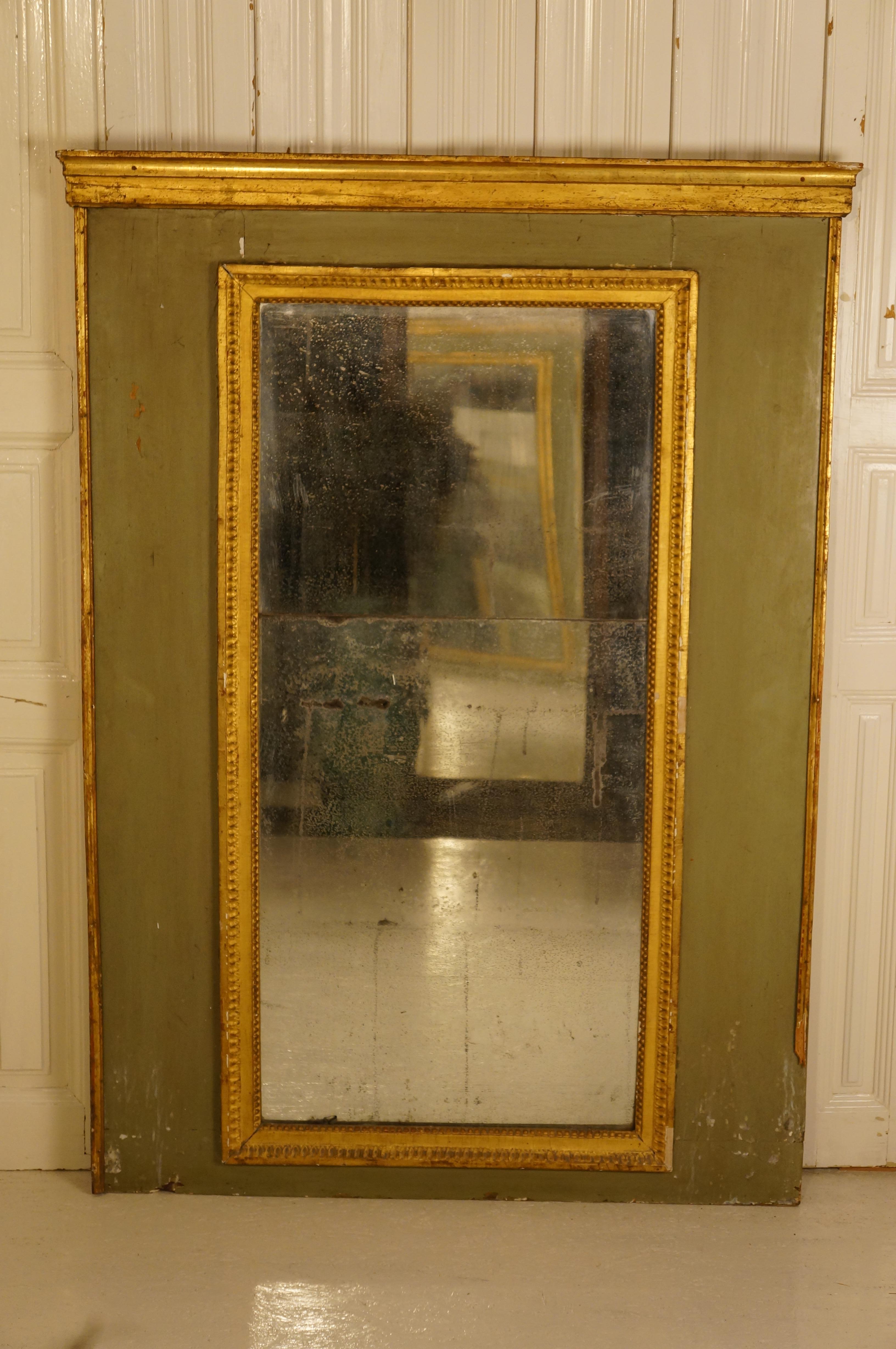 Who knows where this 19th century French Trumeau mirror once held court? With its original olive patina and gilt wood frame & antique split mirror plate, normally it was positioned over a roaring fire place or parlor. Where will you put it?
