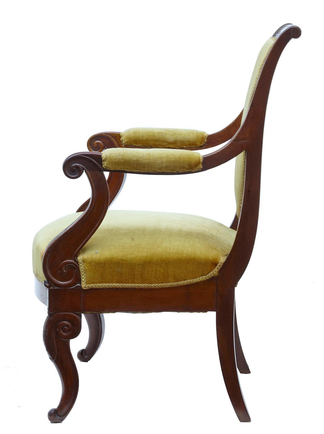 19th century French Empire revival mahogany armchair, circa 1840.

Single French armchair made in mahogany. Shaped back linking to the padded armrests and scrolled arms. Front scrolled legs with tapering legs to the rear.

Upholstered in yellow