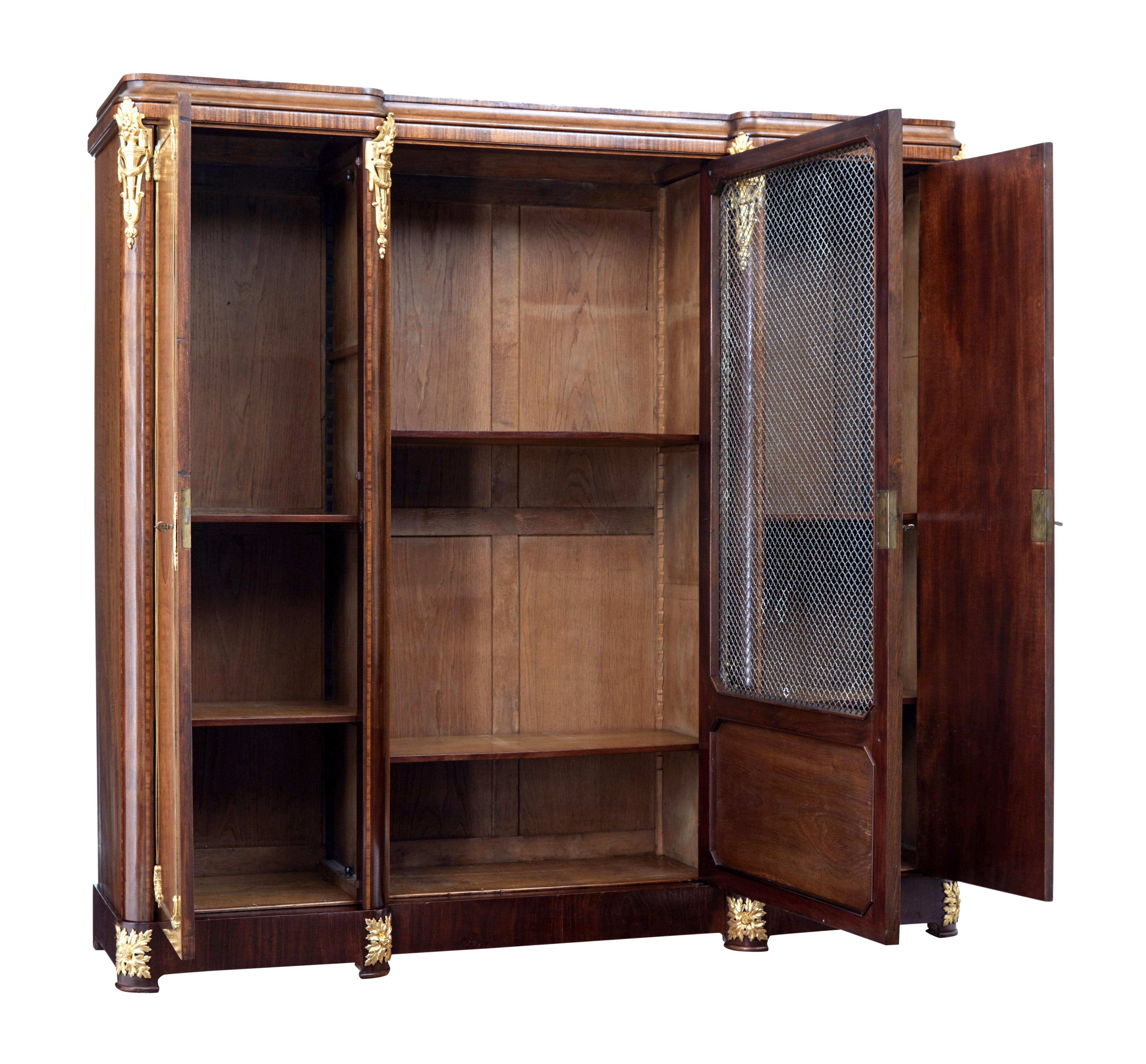 Beautiful bibliotheque circa 1890 to which we have a matching desk.

This cupboard was constructed using a flat pack technique, with panels held in place by bolts.

Central door with decorative latice wire design, flanked either side with a