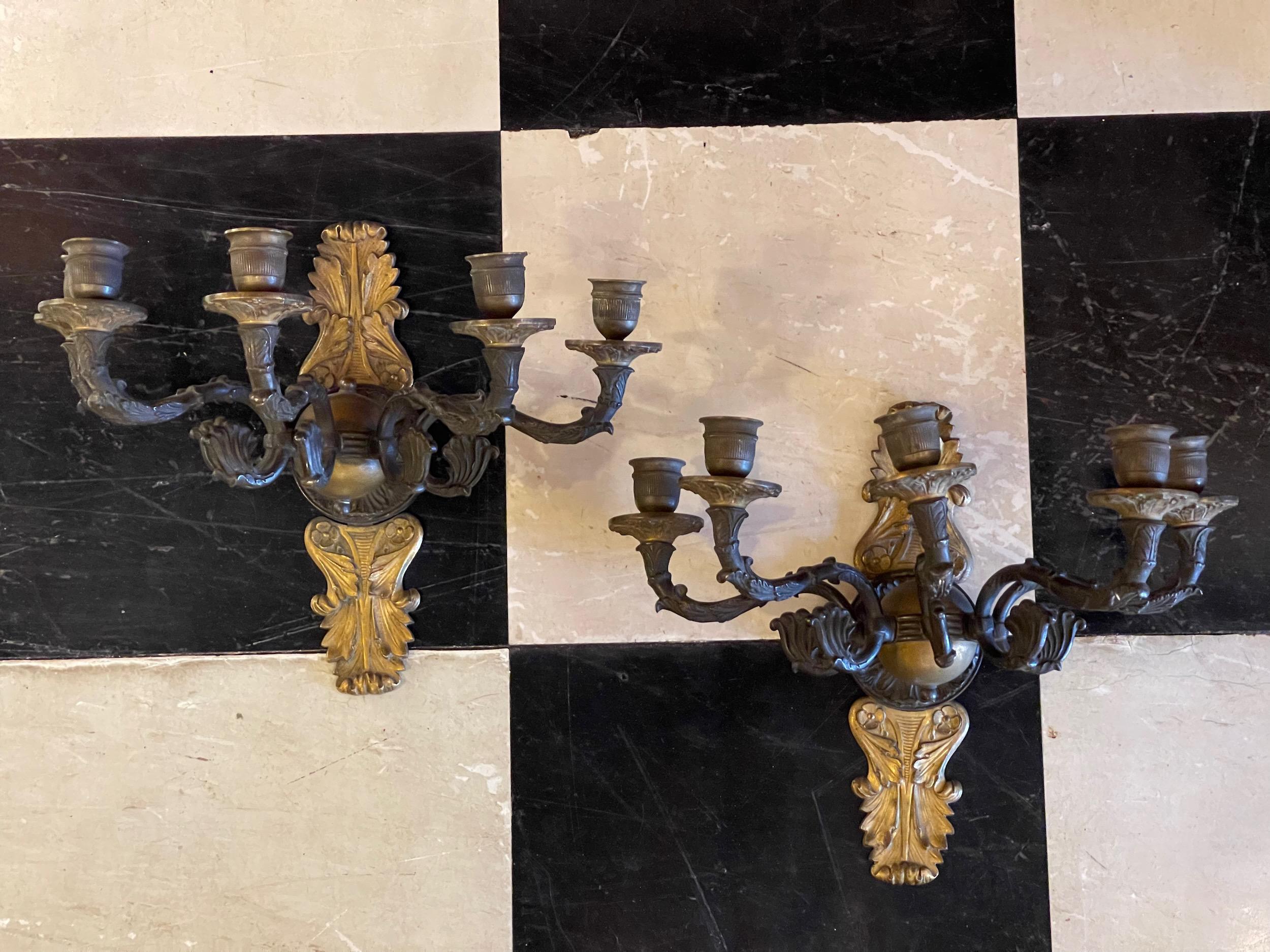 This is a pair of Bronze French Empire Sconces. They are for candles. Could be wired.