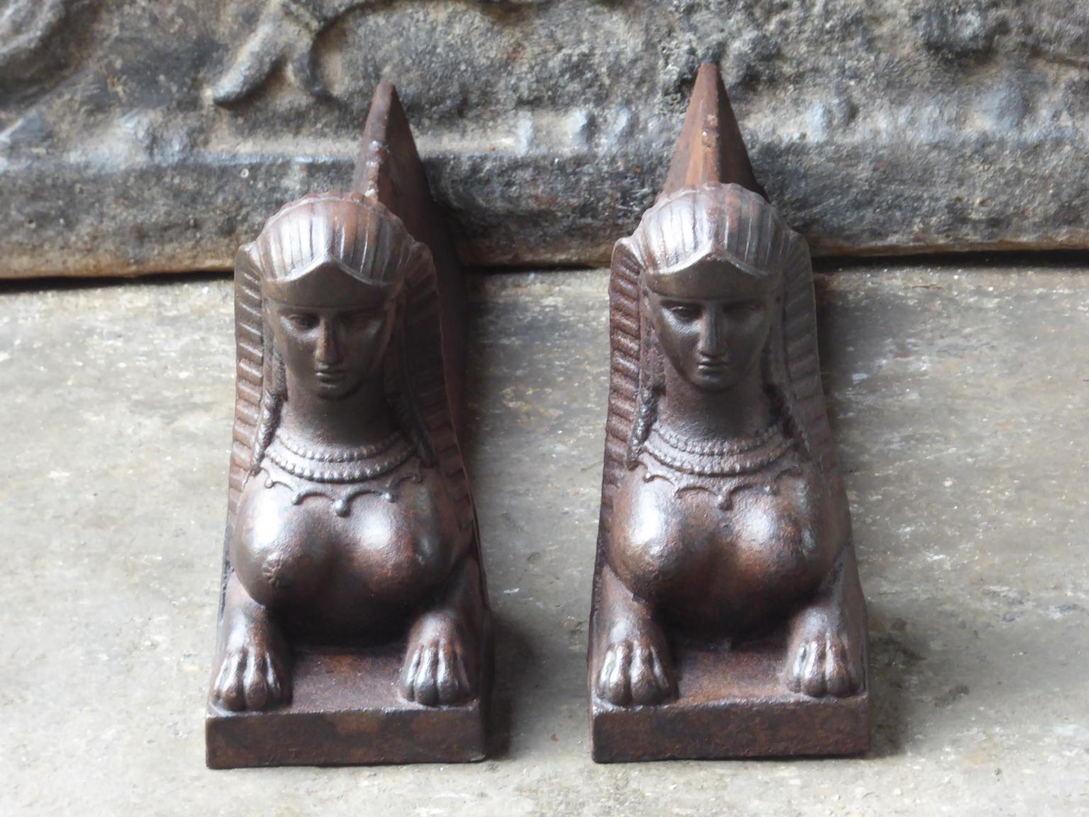 19th century French Empire 'Sphinx' fire dogs made of cast iron. The andirons have a natural brown patina. Upon request it can be made black / pewter. They are in a good condition and are fully functional.







 
