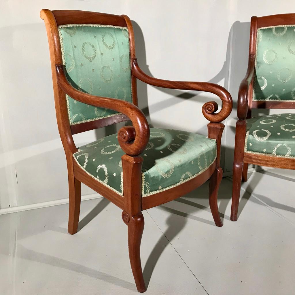Good pair of French mahogany Empire style open armchairs in good vintage upholstery.
Well carved frames and also comfortable to sit on for an evening as they have a good size seat.
They work really well as additional seating in a living room, but