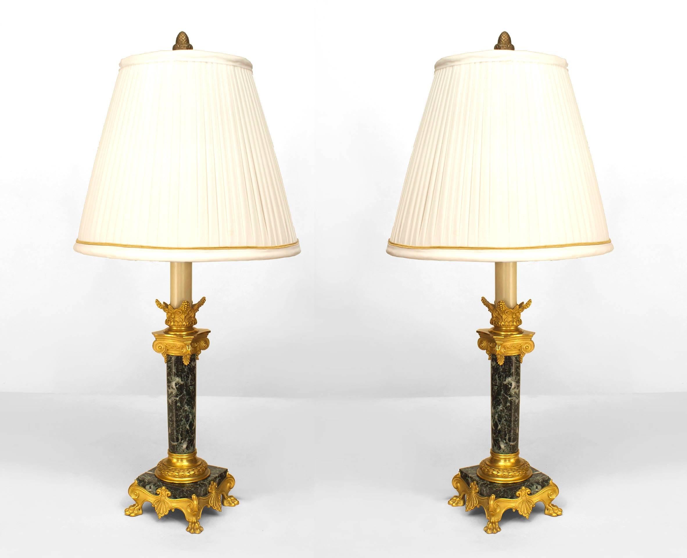 Pair of French Empire style (19th Century) green marble column candlestick lamps with bronze dore trimmed capital and square base (signed F. BARBEDIENNE) (PRICED AS Pair).
