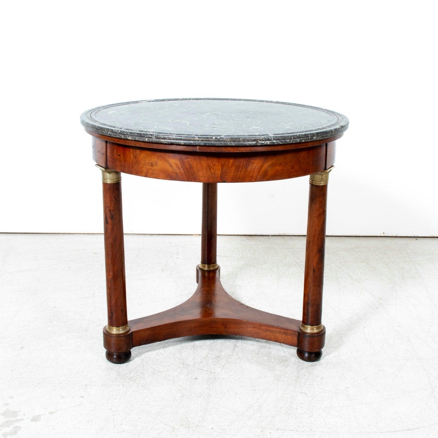 Bold, refined, and unmistakably Parisian, this late 19th century French Empire style guéridon, circa 1890s, embodies the refinement that defined Parisian furniture-making during the Second Empire and early Third Republic. Handcrafted of richly