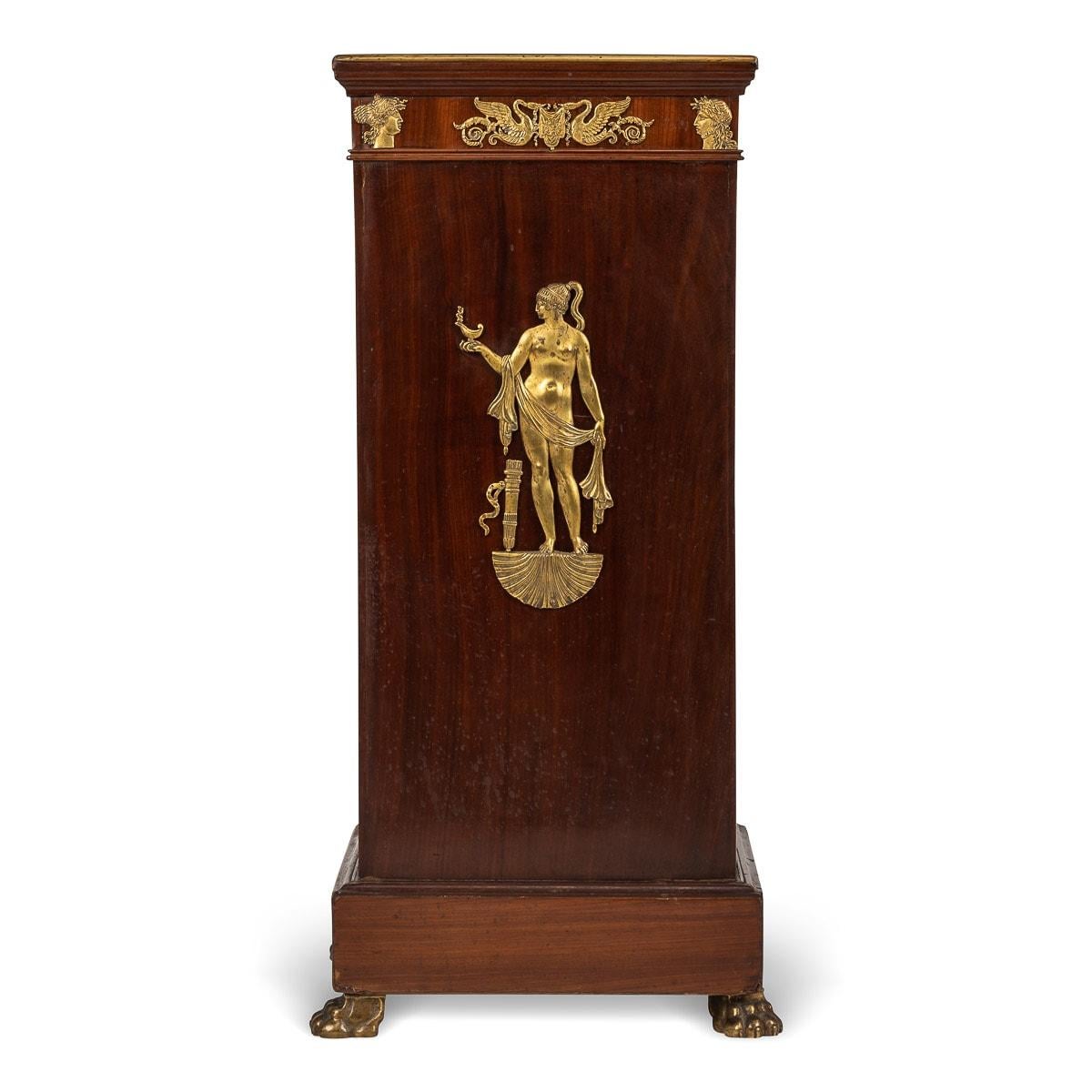Antique late 19th century French ormolu mounted Empire-style pedestal, cast and figurine depicting a Greek goddess along with sculpted heads overlaid with flora. The middle design depicting a pair of swans holding a suspended tapestry with garlands