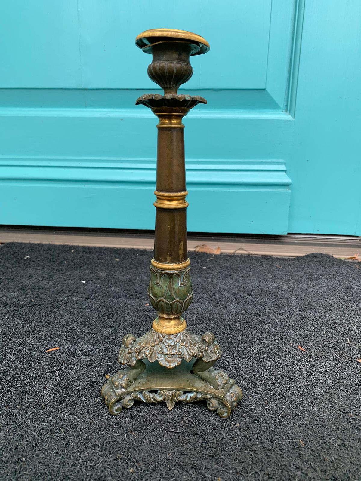 19th century French Empire style patinated and gilt bronze candlestick.