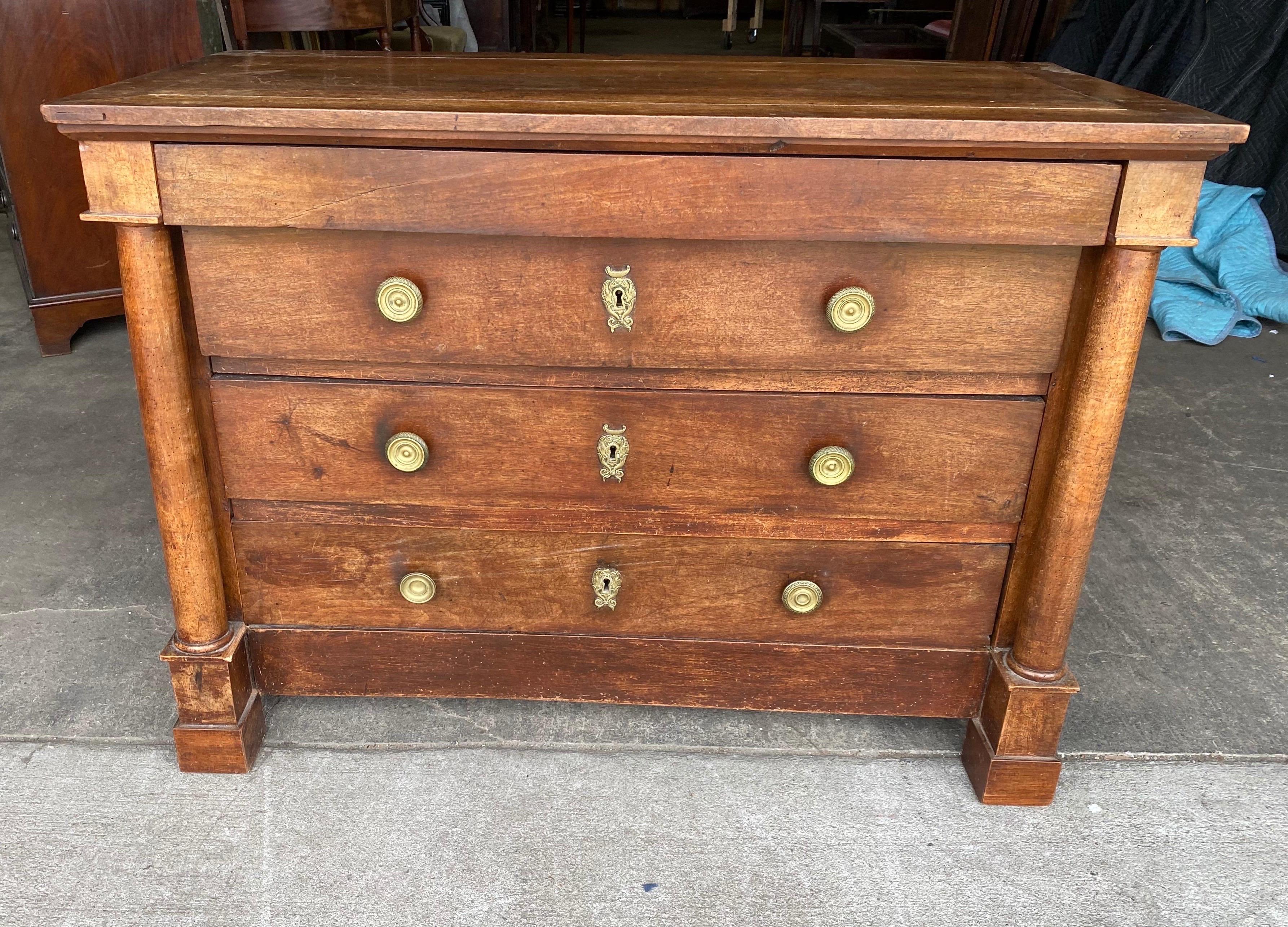 Great color and size 19th century French empire walnut bedside commode. One hidden drawer over three other drawers with columns and plinth feet.