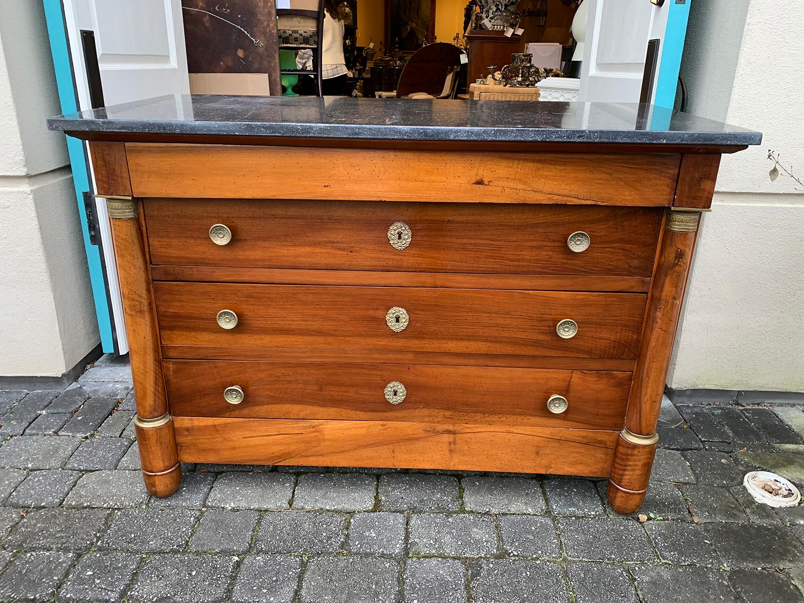 19th century French Empire walnut commode / chest with old fossilized marble top. Four drawers.
Marble top measures 51.25