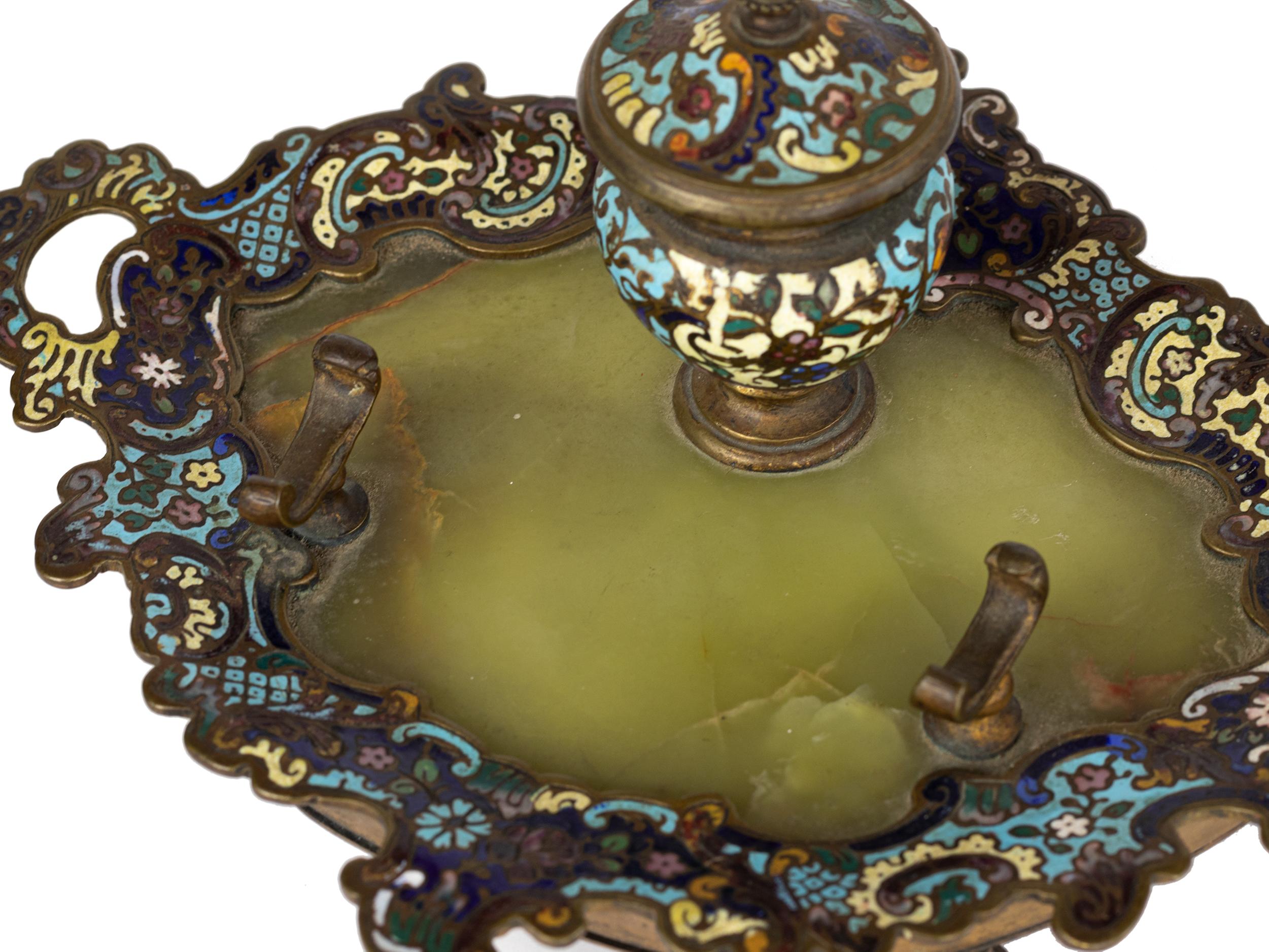 A 19th century french champlevé enameled gilt bronze ornate with colorful blue, green, yellow enameling over the bronze base in a Sevres style decor with a pen rest.  

Width: 8,07 in (20,5 cm)
Depth: 6,7 in (17 cm)
Height: aprox 3,54 in (9 cm)
Base