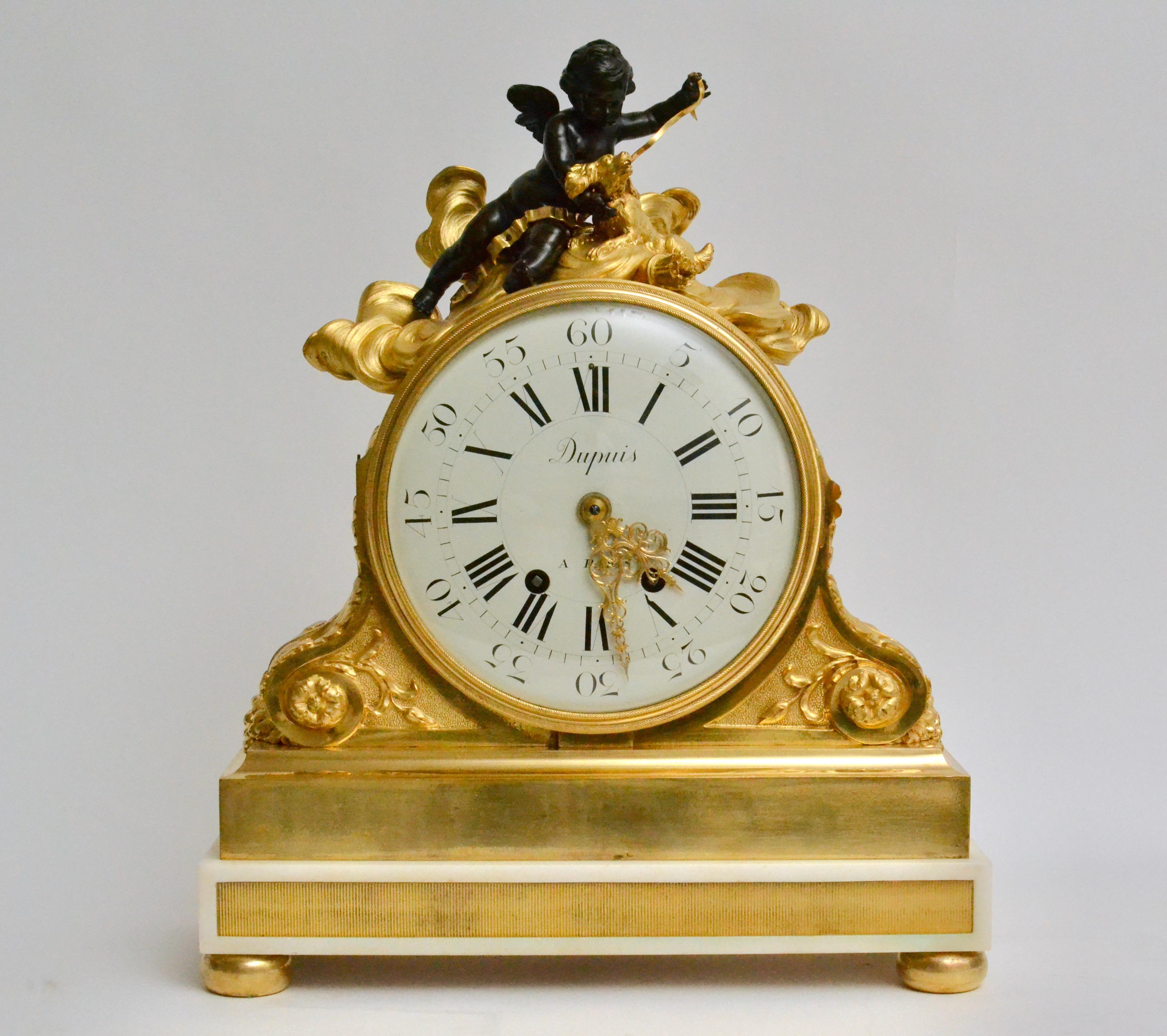 An important and large late 19th century gilt bronze and Carrara marble clock. The gilt bronze and marble clock case signed by Escalier de Cristal, Paris and clockwork by Dupuis a Paris. With inscription: 