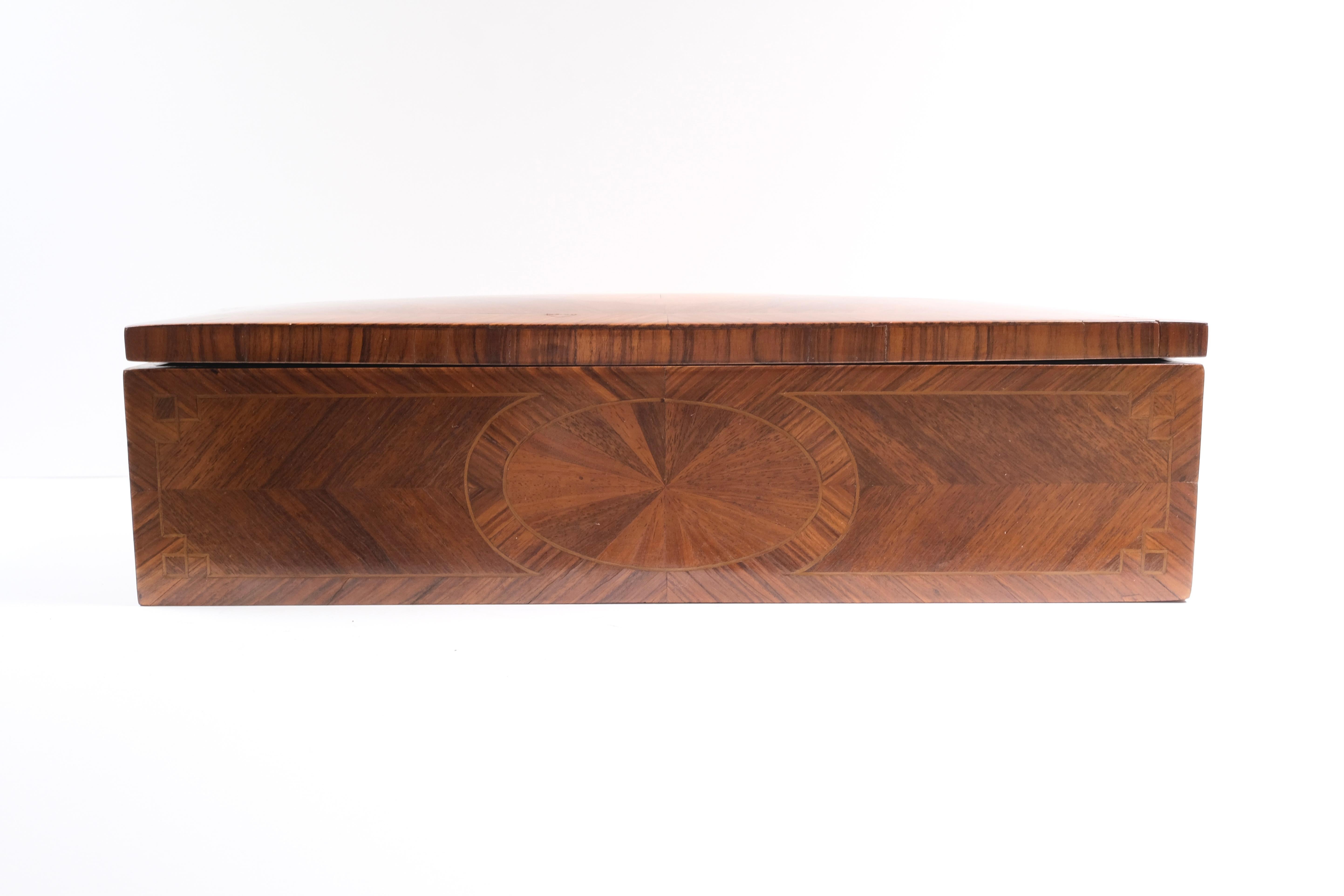 Inlaid with several different exotic woods including walnut. Medallion inlay.