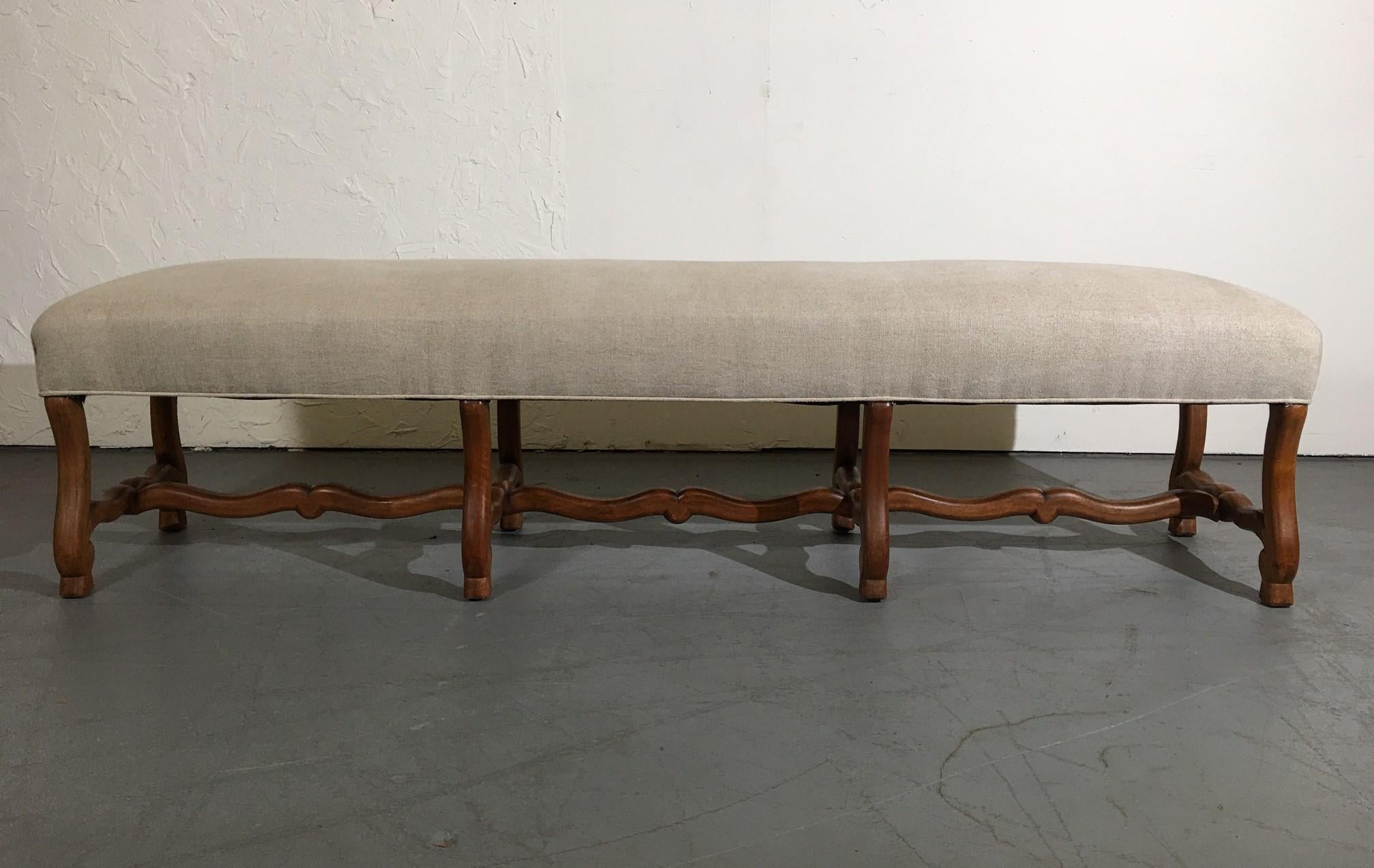 19th-century Louis xiv style walnut extra-long bench. Upholstered in linen.