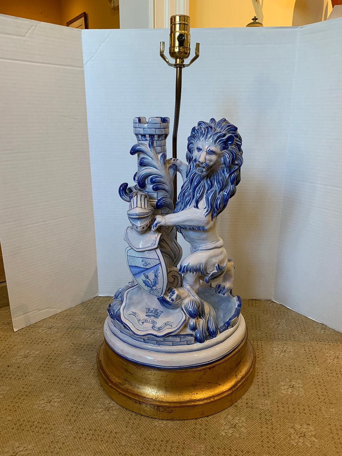 19th century French faience blue and white hand painted porcelain lion figural lamp by Saint Clement, signed, on custom giltwood base
New wiring.