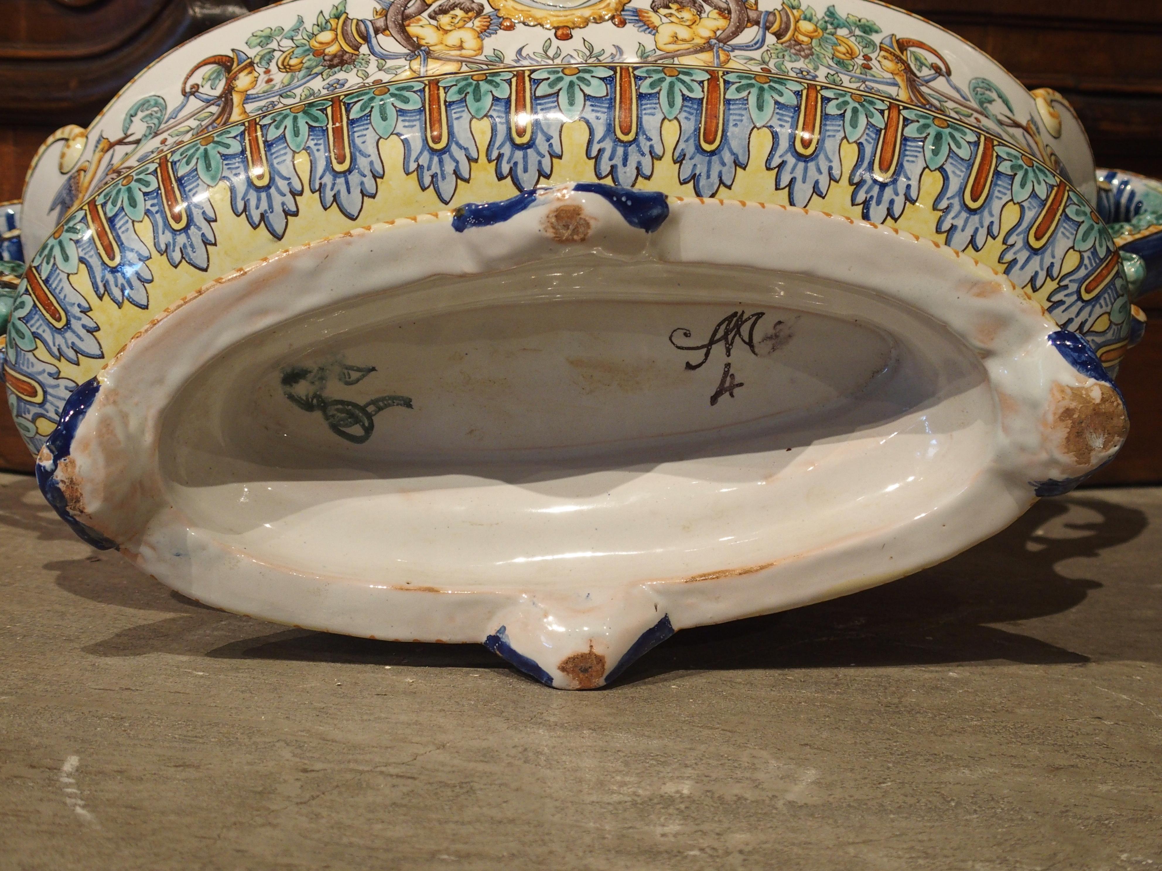 This colorful French faience jardinière, is signed by Antoine Montagnon, of Nevers, France (bottom.) The town of Nevers is a well known faience production center in France. They have been producing high quality pieces since the beginning of the 17th