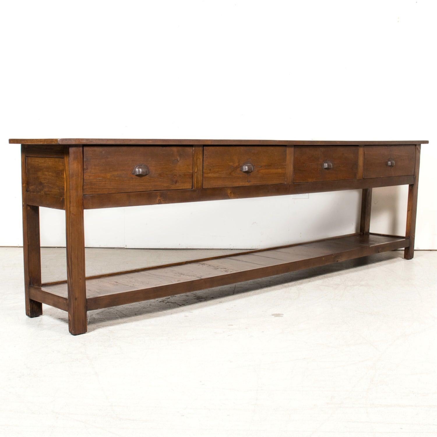 A striking mid-19th century Country French console table, converted from an antique farm table hand-crafted in Normandy, circa 1850s. This authentic piece exemplifies the simple elegance of Normandy furniture, known for its rustic charm, sturdy