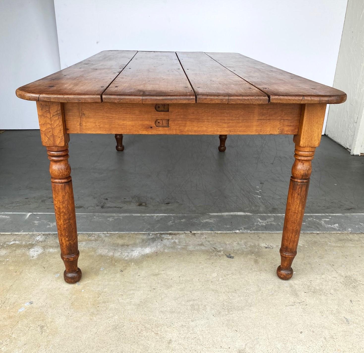 19th-century French farm table with a single drawer on one side.
