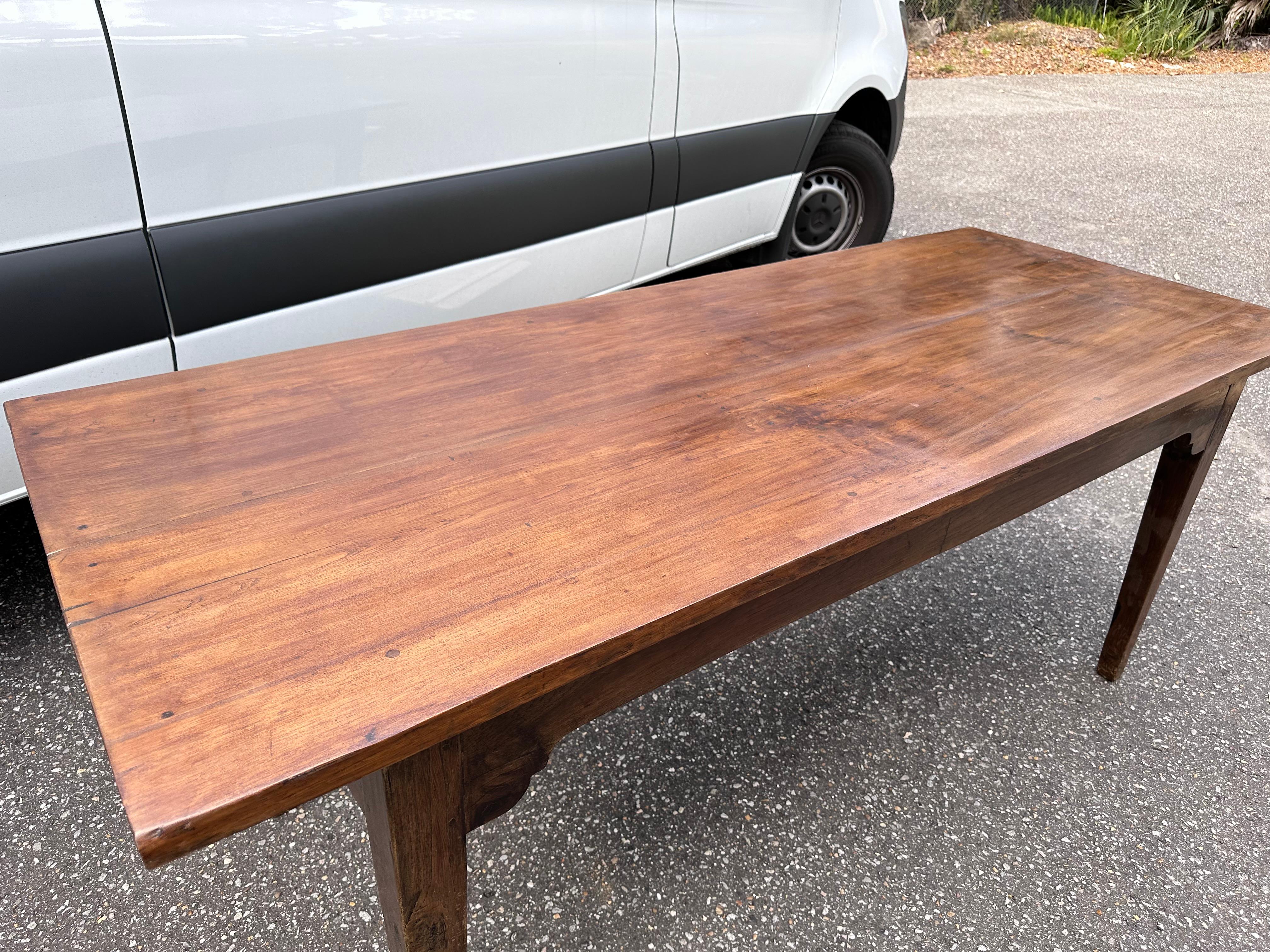 This is a beautiful 19th century French farm table! The wood is of a dark color and beautifully waxed the scalloping above the legs add the perfect touch of refined elegance. This item is perfect for any lover of traditional interiors and would make