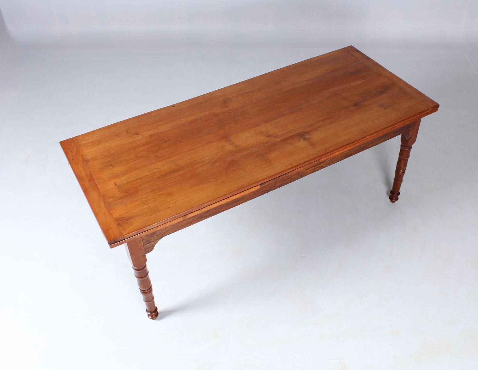 France
Cherry, chestnut
19th century, Louis-Philippe, circa 1850

Dimensions: H x W x L 79 cm x 80 cm x 197 cm (+ 76 cm + 84 cm)


French country house or farmhouse table from Normandy.

Turned legs with multiple profiles in solid