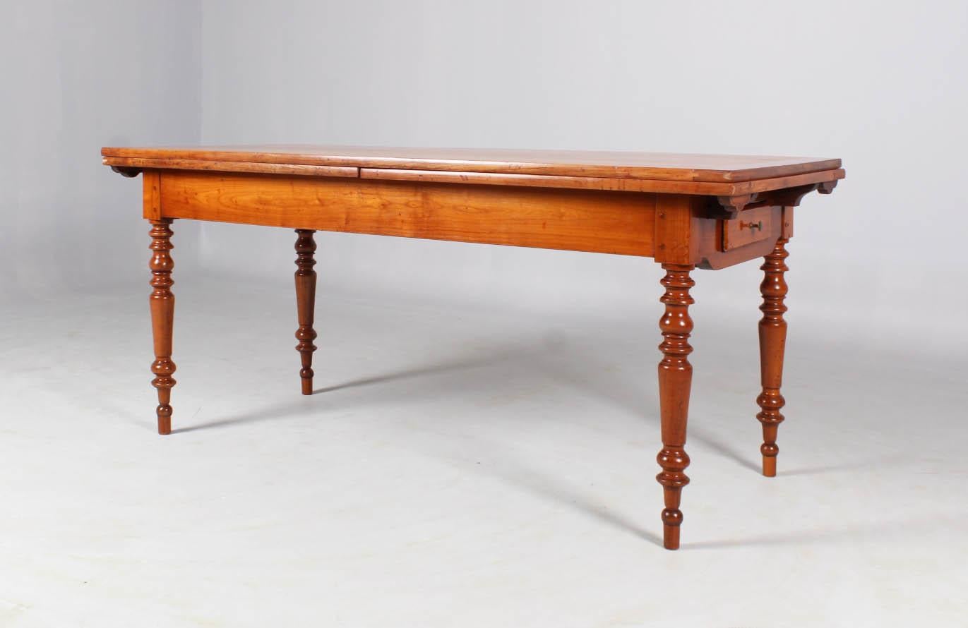 Antique farmhouse dining table

France
cherry tree,
second half 19th century

Dimensions: length 180-360 cm, width 80 cm, height 79-81 cm

Description:
Country house table from the French province.

Multiple profiled turned