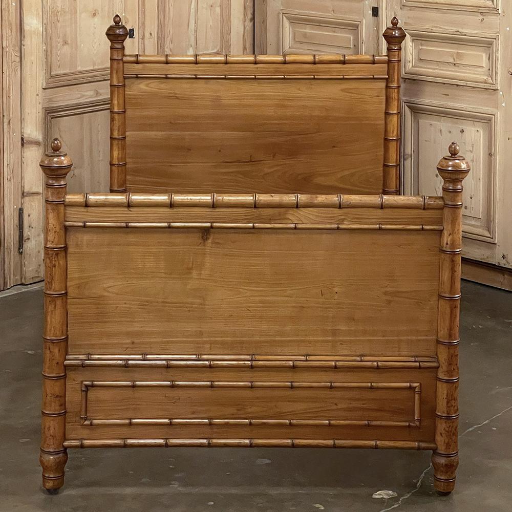 19th century French Faux bamboo bed is a wonderful expression of Oriental design executed in maple and pine to simulate bamboo. Popular during the Belle Epoque, the design capitalized on the European craze for Japanese and Chinese designs and