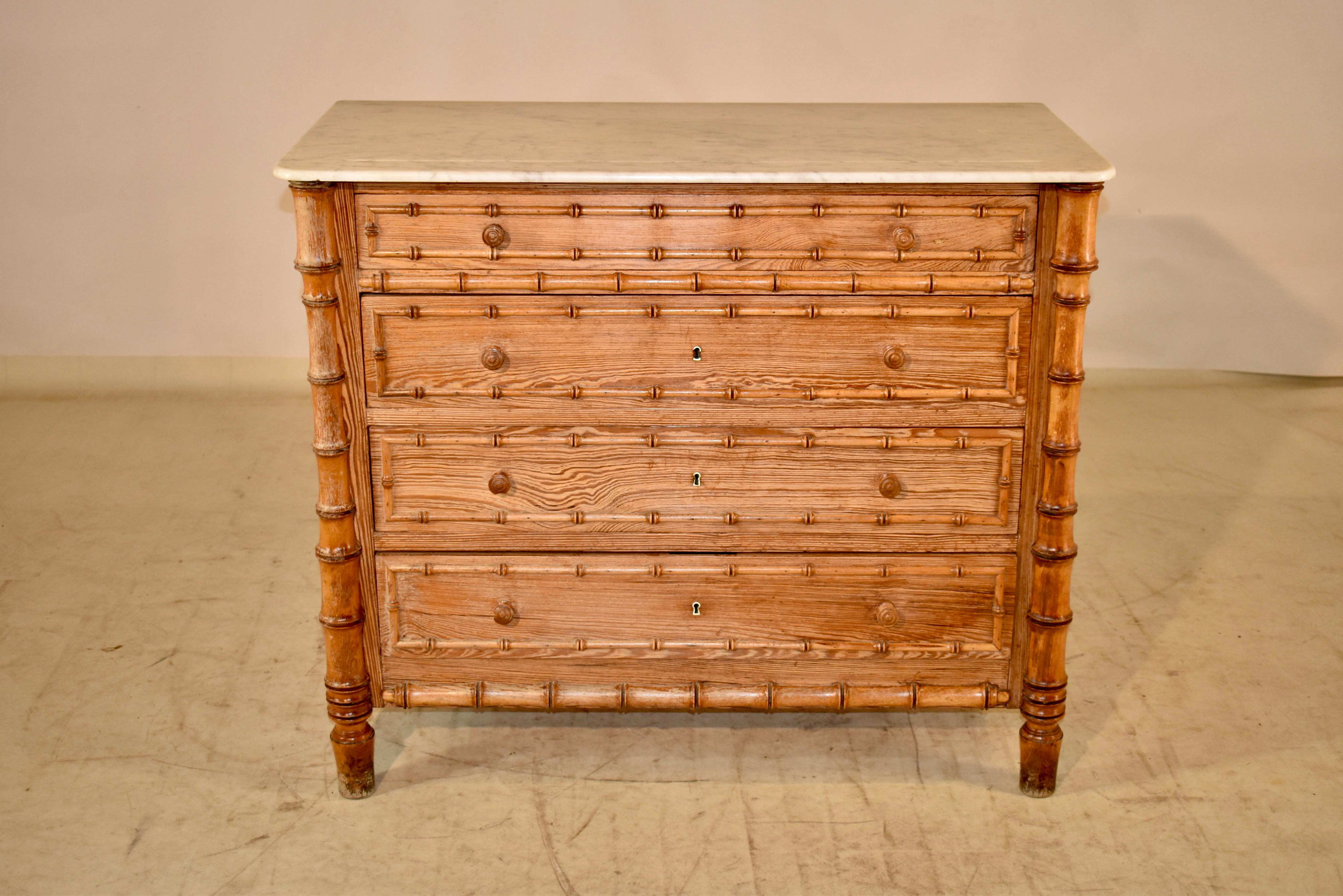 19th century pine and cherry faux bamboo chest of drawers from France. The top is original to the piece and is made from what appears to be carrara marble. The top is removable and sits on top of the case, which is made of pitch pine, and is