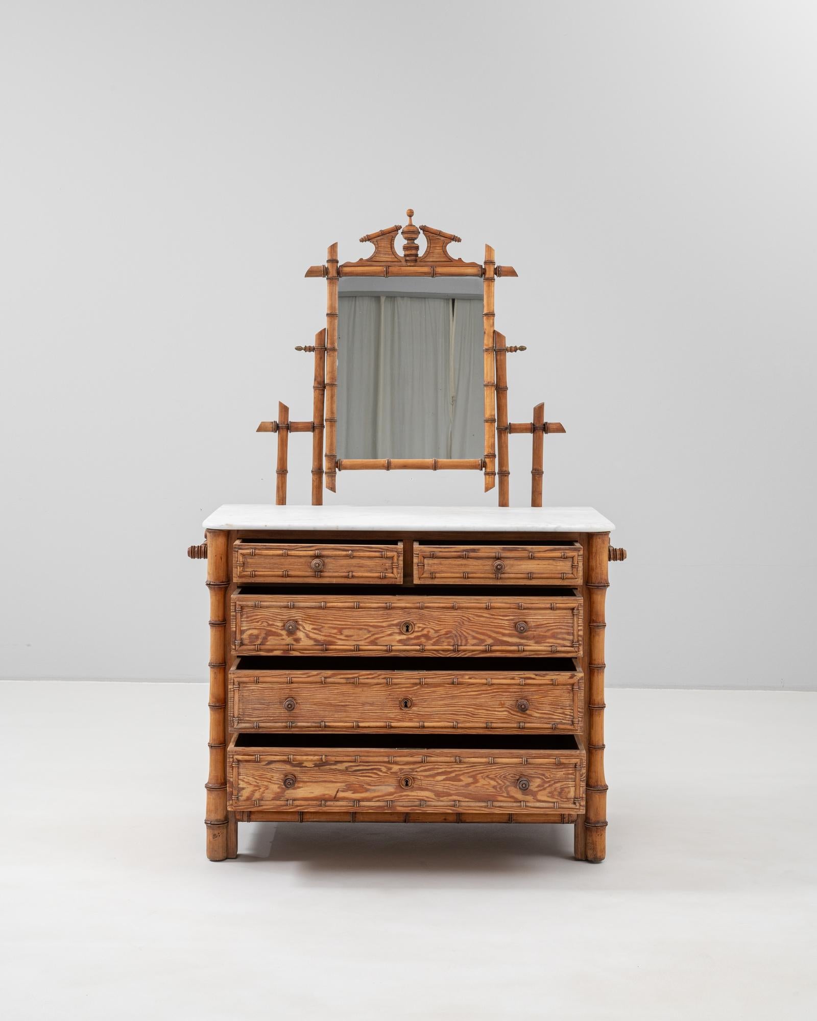 This exquisite 19th-century French faux bamboo chest of drawers is a charming example of craftsmanship and style. Featuring a stunning marble top, the piece includes four spacious drawers, perfect for storage. The faux bamboo detailing adds an