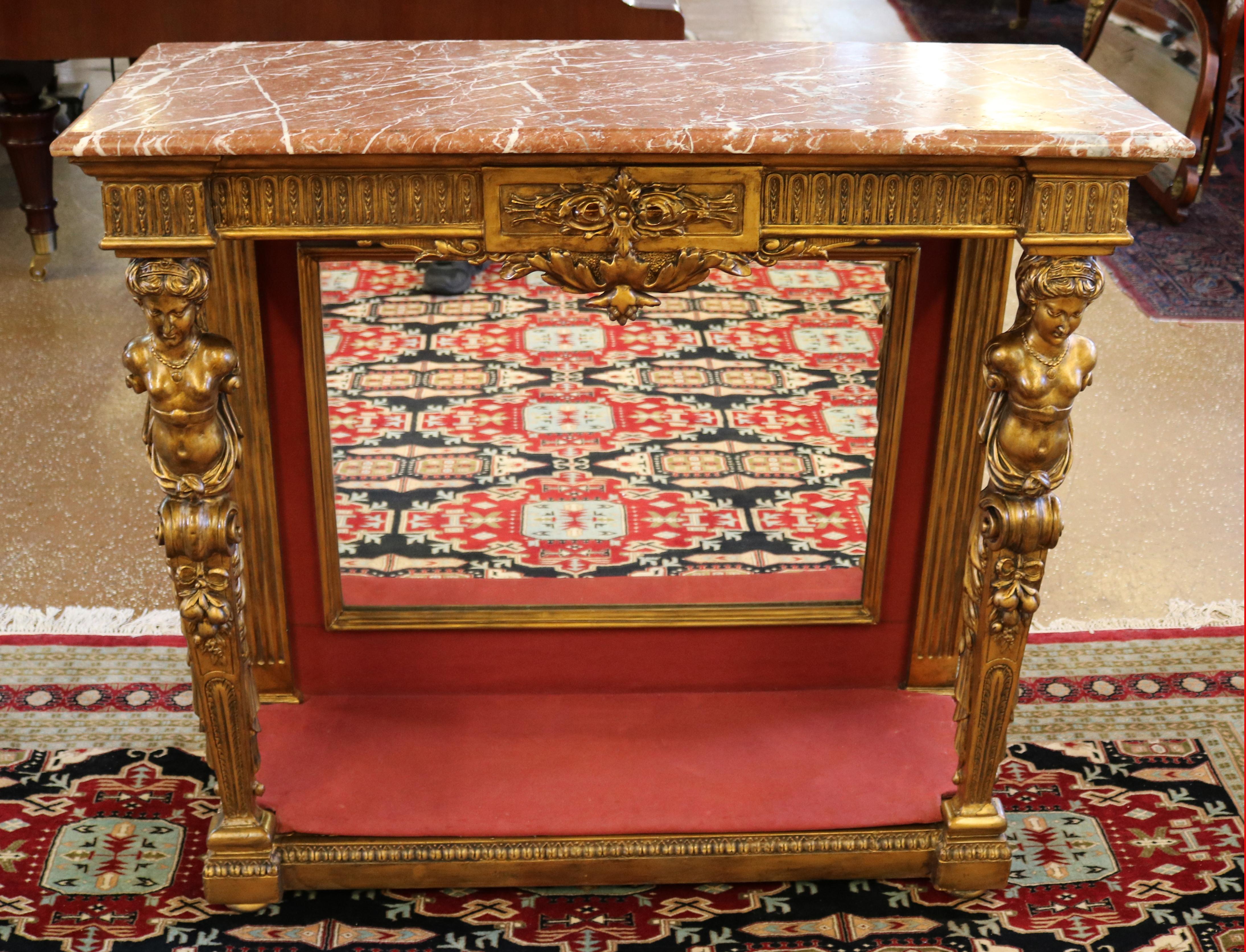Stupéfiante table console figurative française du 19e siècle à plateau en marbre doré et à dos de miroir

Dimensions : 41