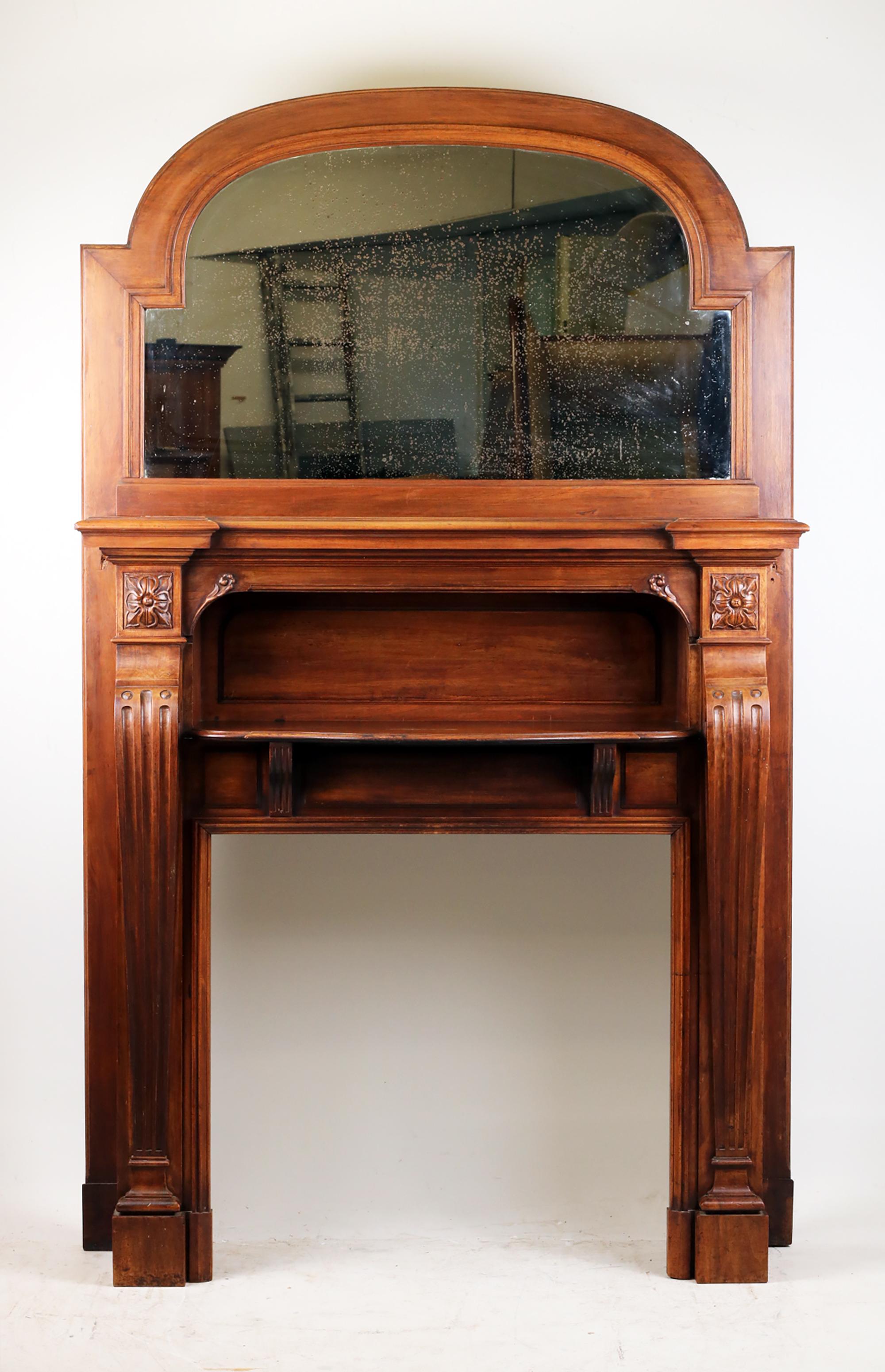 Fire Place Mantel with mirror,
ca. 1870-1880 France,
Solid walnut,

Spectacular French Fire Place Mantel made of solid walnut. 
Tapering pilasters carved with organic reliefs. Original antique mirror (At the customer's request, the mirror can be