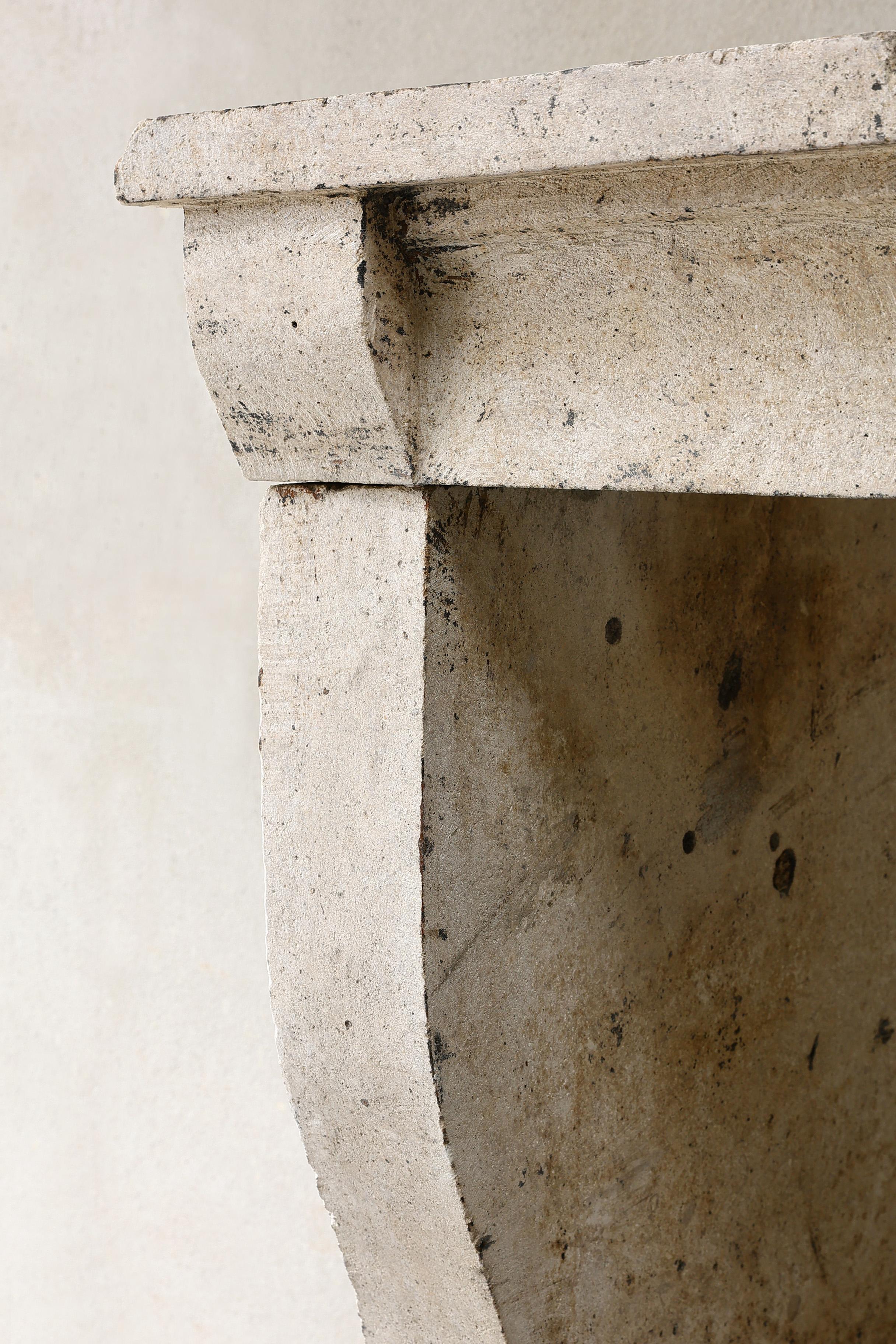 19th century French fireplace of limestone in a simple style 4