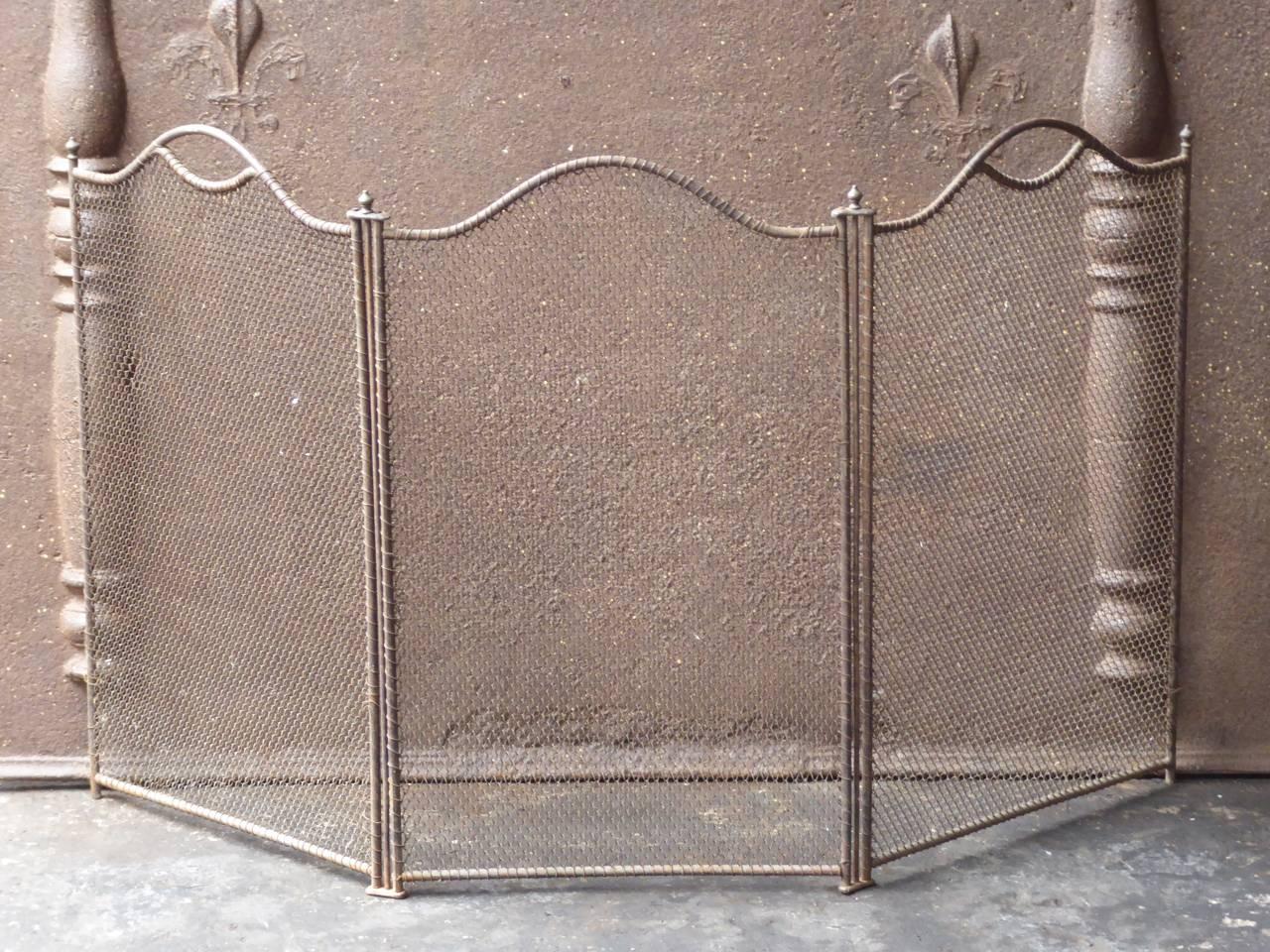19th century French fireplace screen made of iron and iron mesh.

We have a unique and specialized collection of antique and used fireplace accessories consisting of more than 1000 listings at 1stdibs. Amongst others, we always have 300+ firebacks,