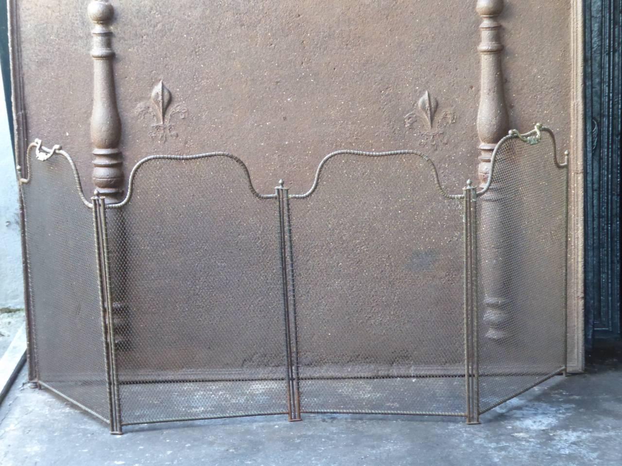 19th century French Victorian fireplace screen made of iron and iron mesh.

We have a unique and specialized collection of antique and used fireplace accessories consisting of more than 1000 listings at 1stdibs. Amongst others we always have 300+