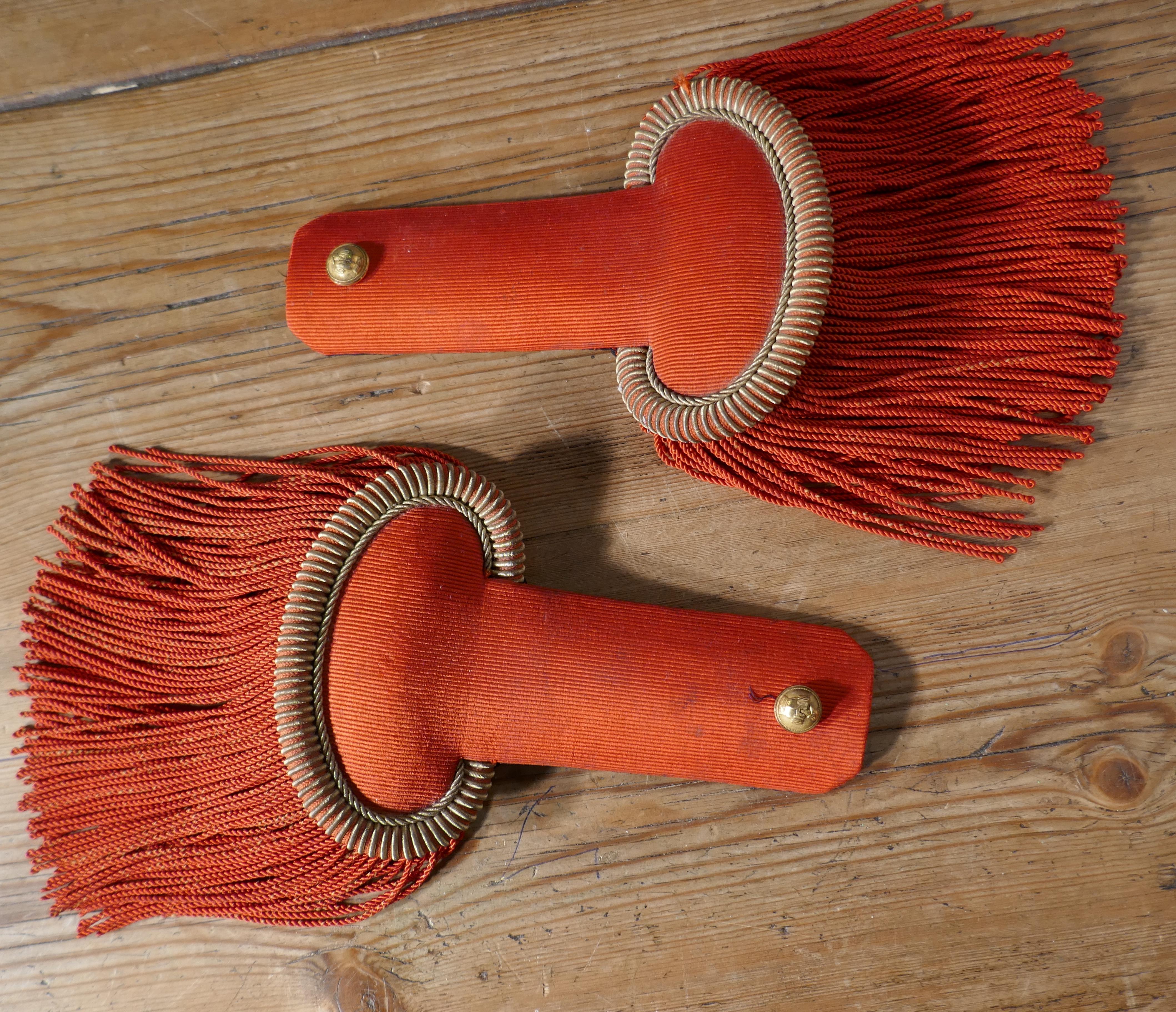 19th Century French First Officer’s Uniform Red Epaulettes

Good pair of French Officers Epaulettes made in Red Silk and lined in black velvet, the fixing clip is made in a silver coloured metal and marked MB with the head of Marianne embossed on