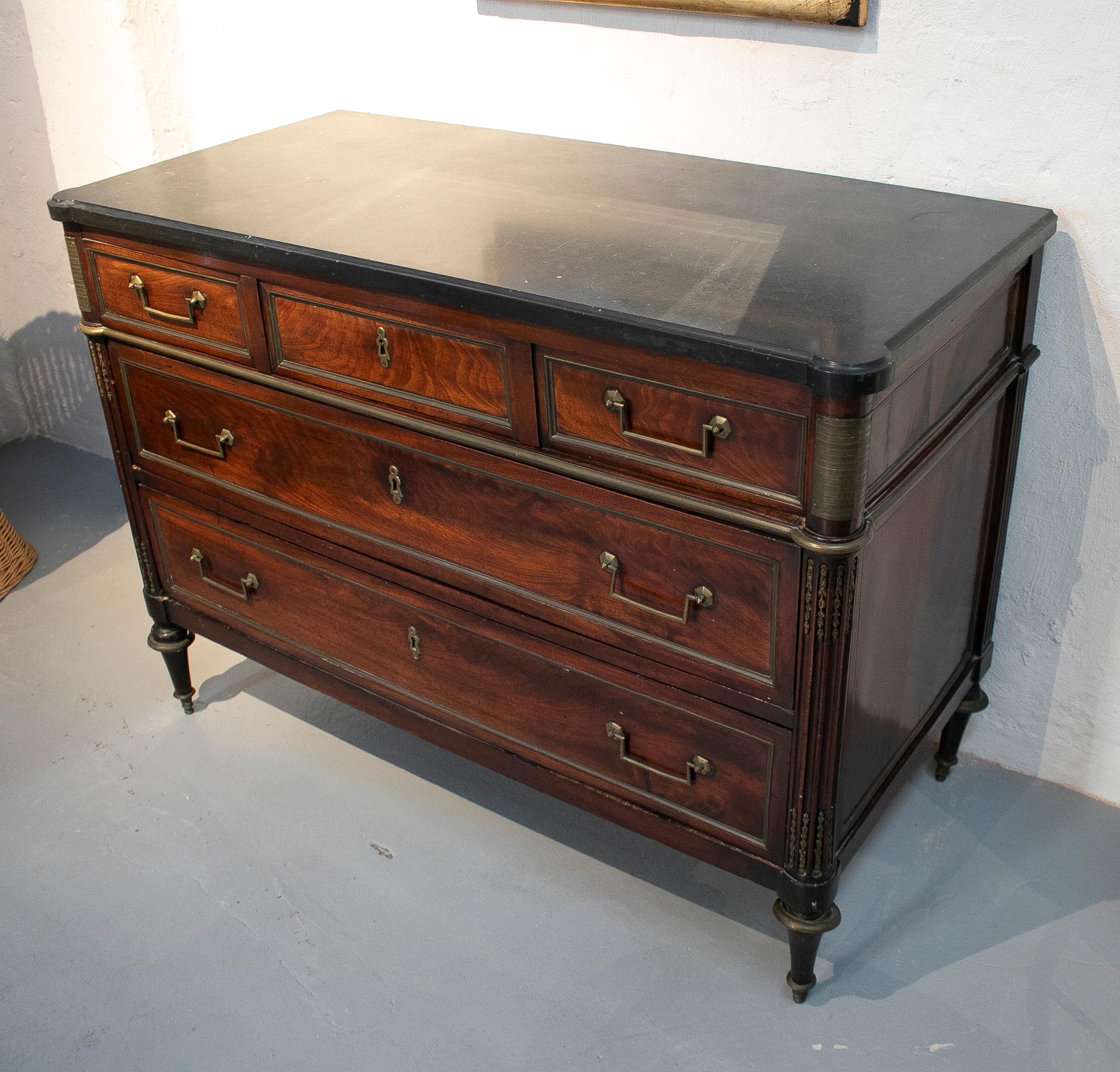 19th century French five-drawer chest with bronze decorations.