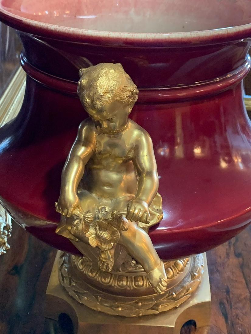 Porcelain 19th Century French Flambe Glazed Oxblood Centerpiece with Fine Gilt Bronze For Sale