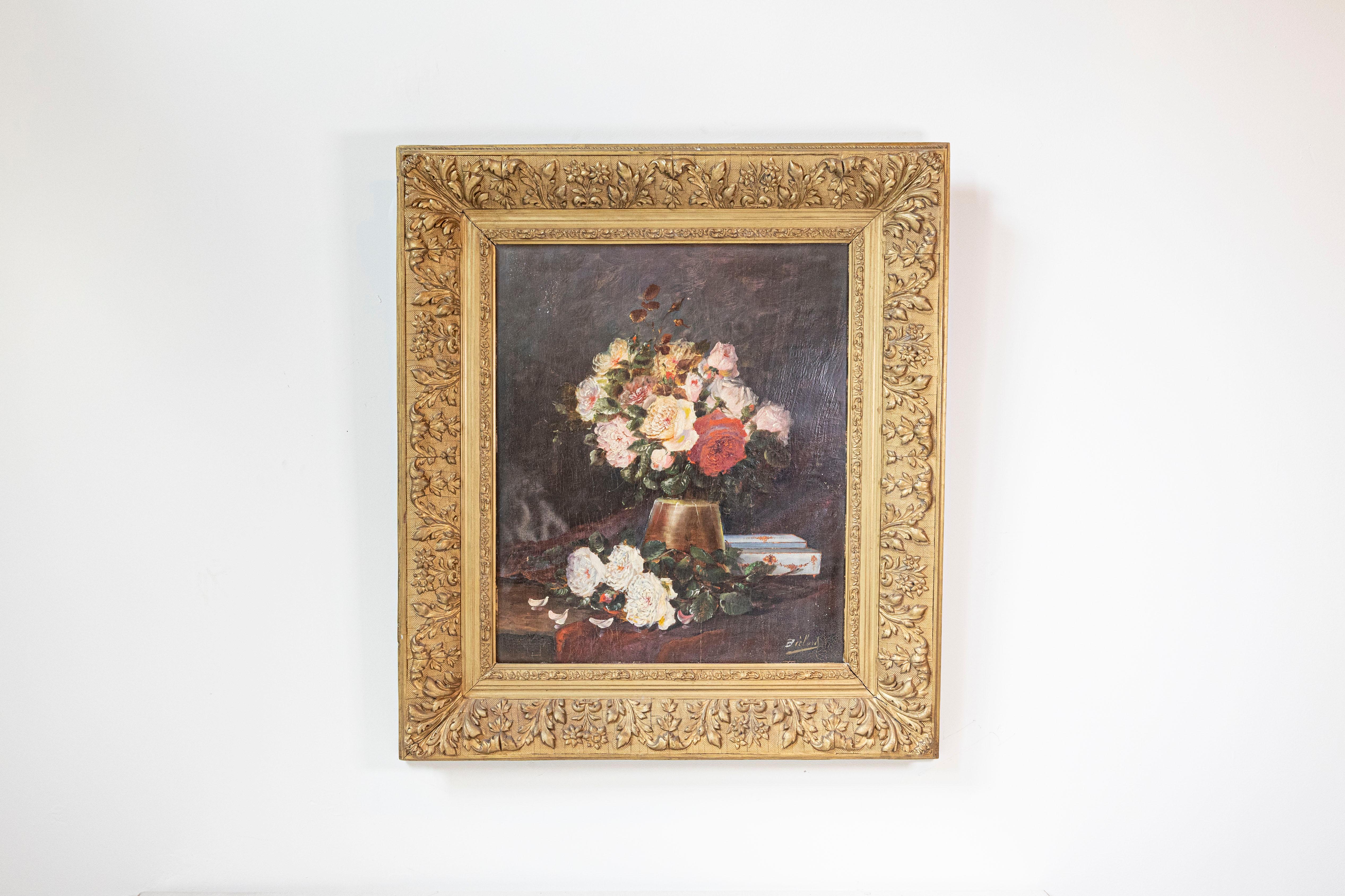 A French floral still-life painting from the 19th century in original frame. Born in France during the politically dynamic 19th century, this exquisite painting features a lovely bouquet of pink, red and yellow roses displayed in a copper-hued vase,