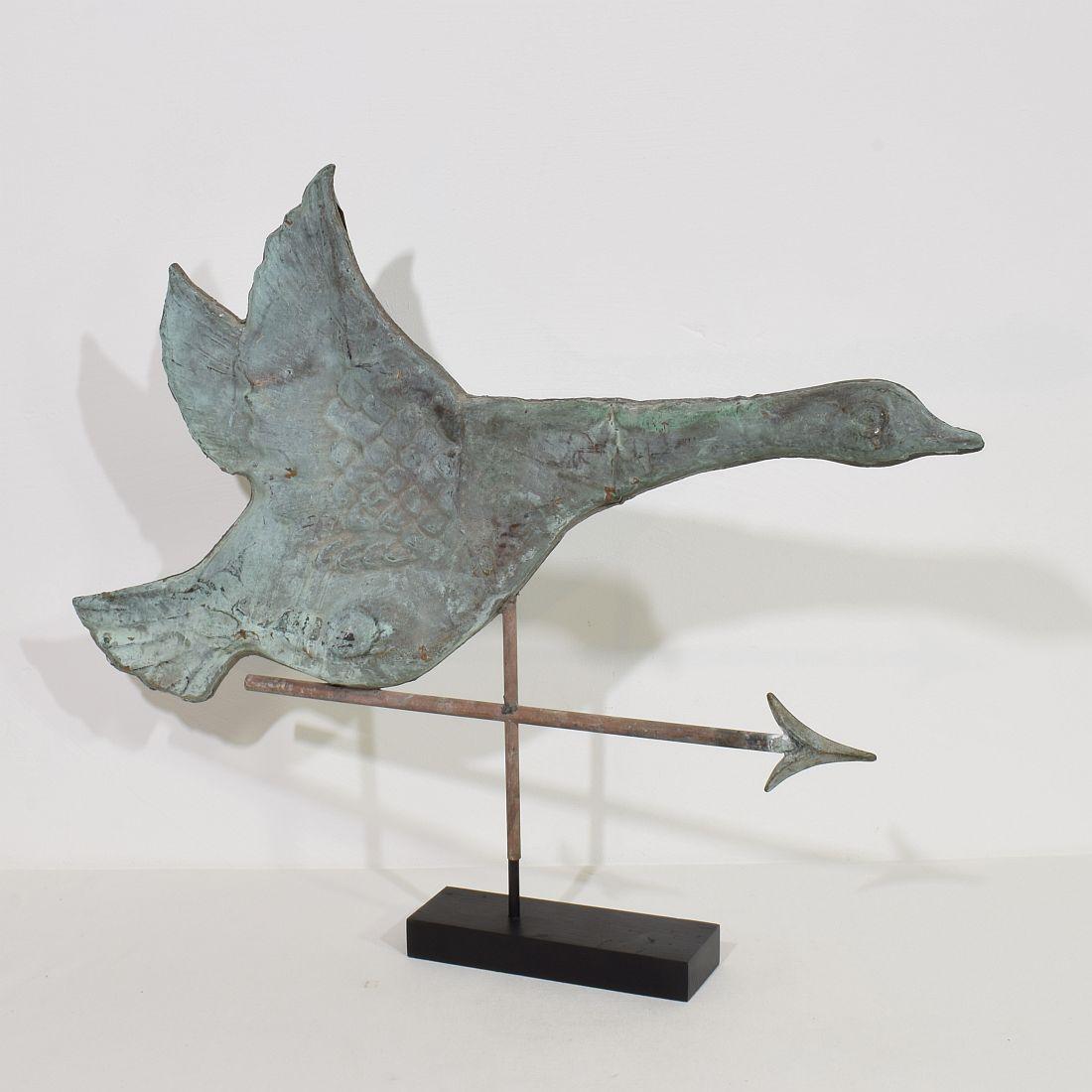 Wonderful and very rare flying goose weathervane in copper with its beautiful vert de gris patina.
France, circa 1880. 
Weathered . measurements include the wooden base.
More photo's available on request.
