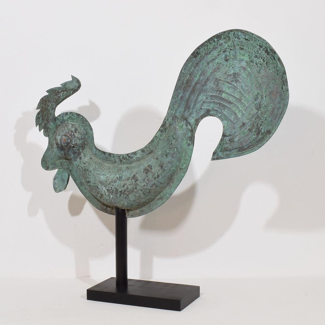 Beautiful and rare antique folk art copper rooster with an wonderful vert de gris patine. A real unique find.
France, circa 1800-1850. More photo's available on request
Weathered. measurements include the wooden base.
H:64,5cm  W:68cm D:14cm 