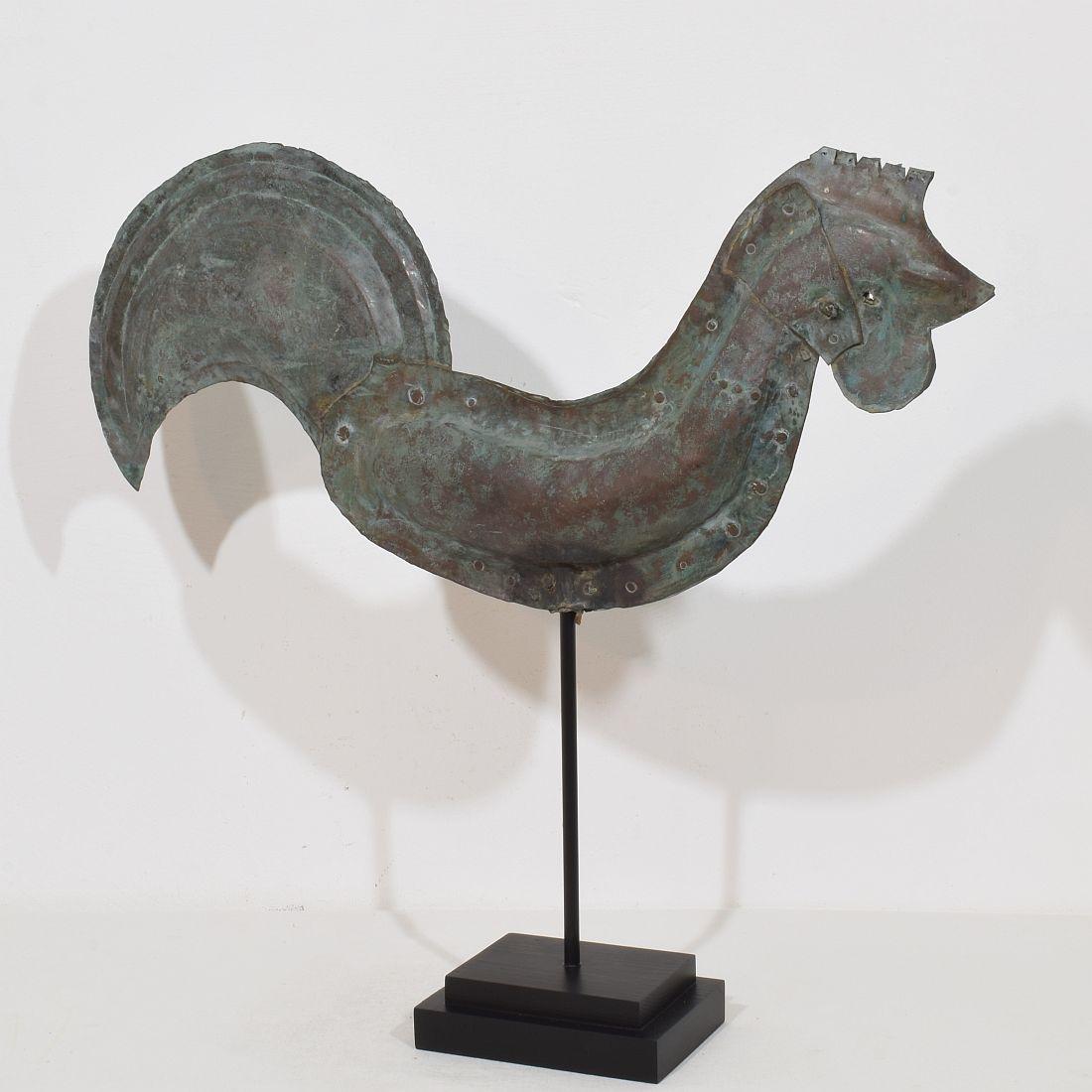 Beautiful and rare antique folk art copper rooster with an wonderful vert de gris patine. A real unique find.
France, circa 1800-1900. More photo's available on request
Weathered and old repair. measurements include the wooden base.
H:55,5cm  W:62cm