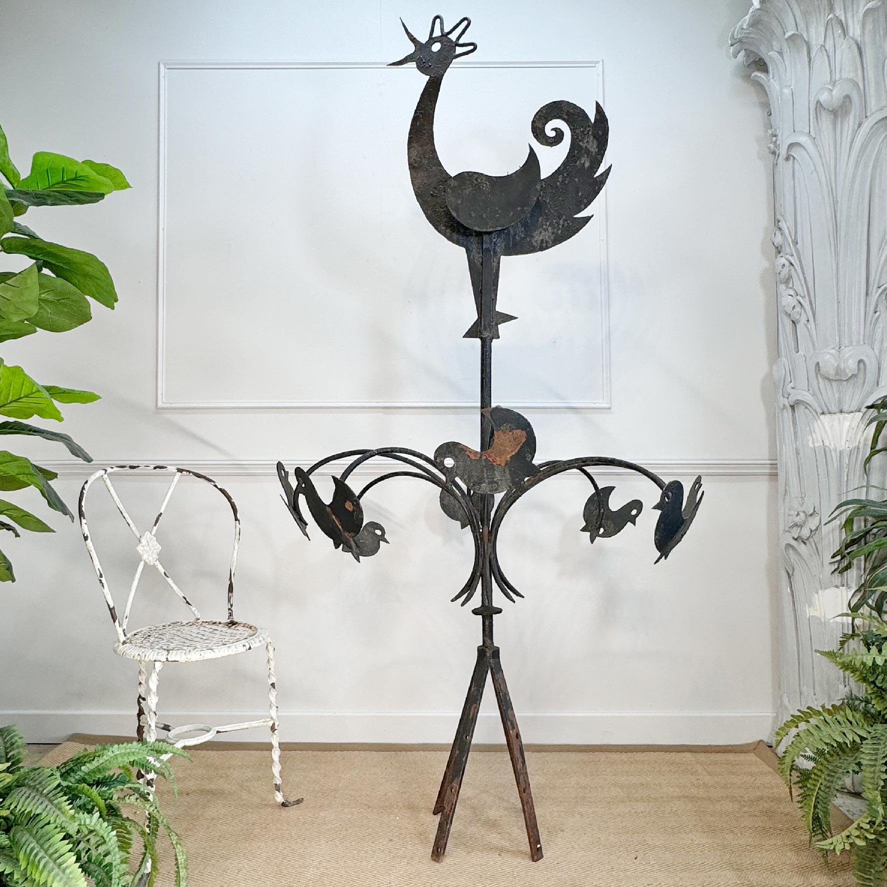 An incredible Folk Art Vane or Finial, hand forged in France in the late 19th century, the huge sculpture shows a large mother hen surrounded  by her chicks. We believe that this was originally placed on the top of a barn in rural France. A highly