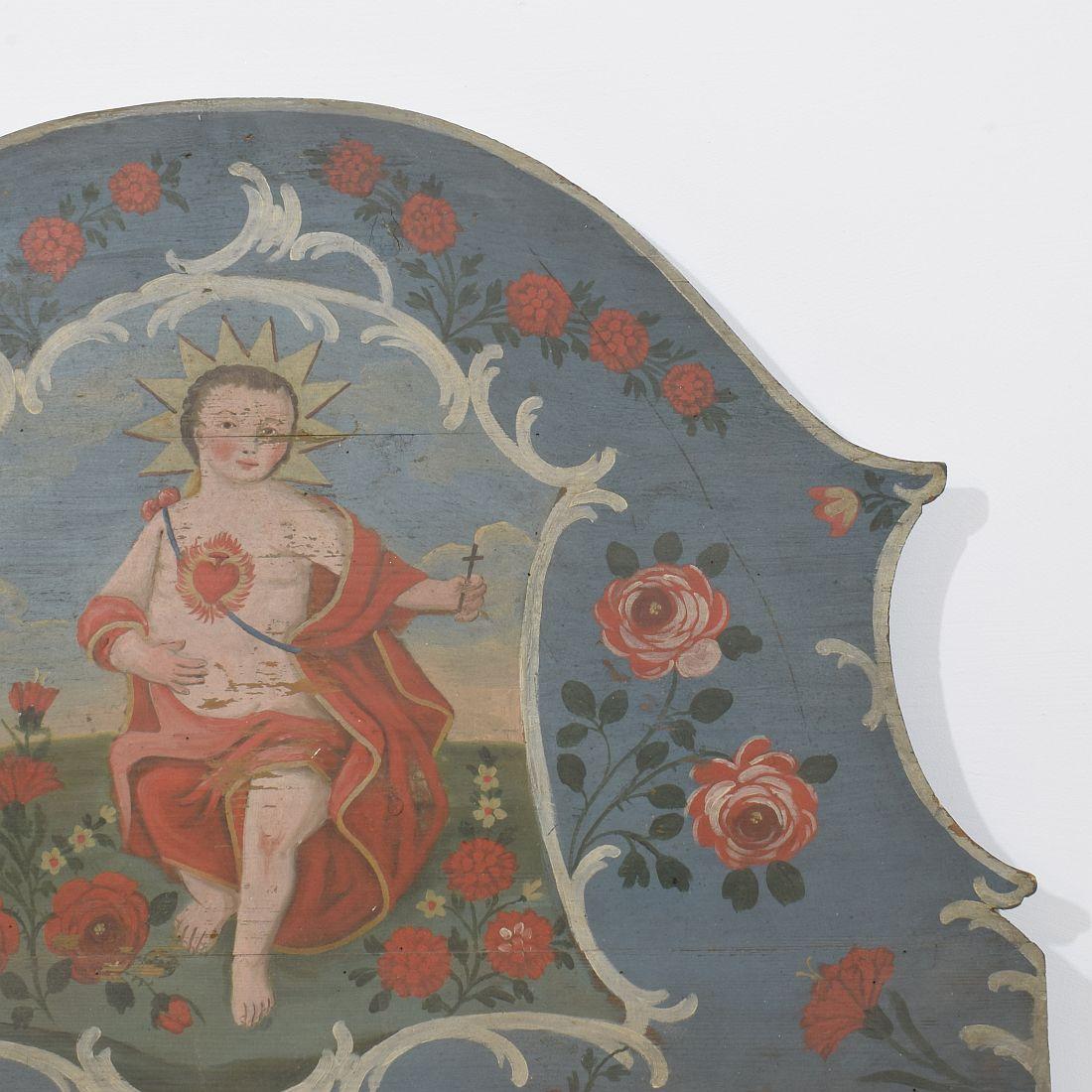 Fait main Panneau en bois peint d'art populaire français du 19e siècle avec un bébé Christ en vente