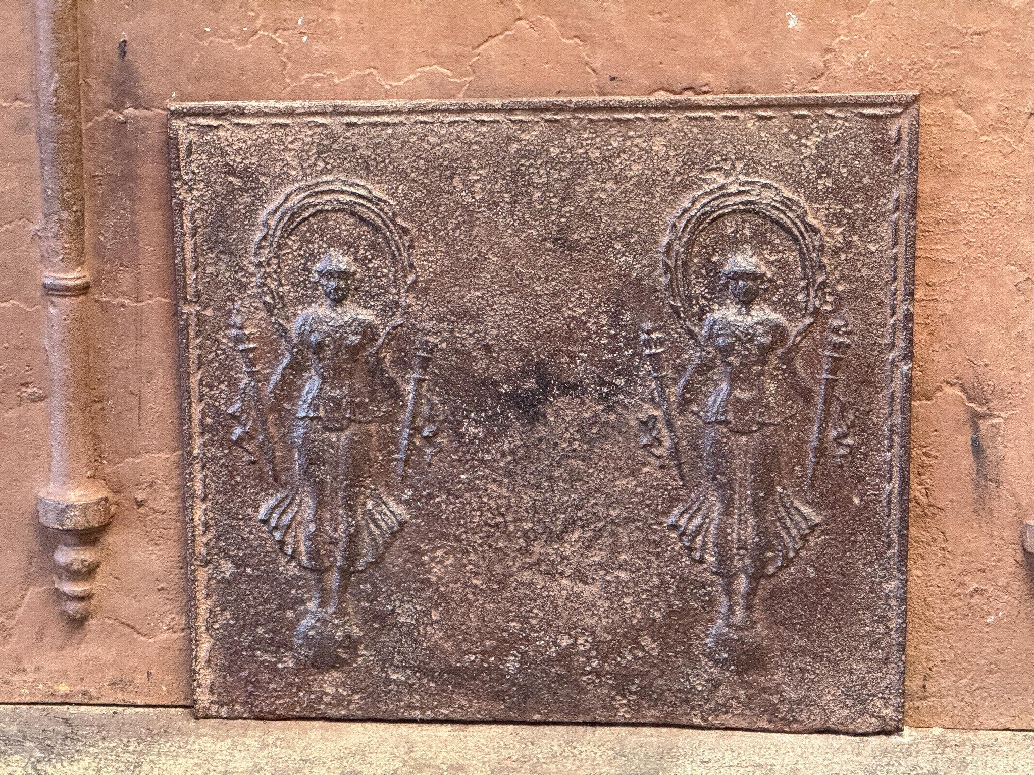 19th Century French fireback of Fortuna, goddess of fortune and fate. The style of the fireback is Neoclassical Period.

Fortuna stands on a sphere, symbolizing the uncertainty of earthly happiness and adventure. The wind that blows her sail or veil