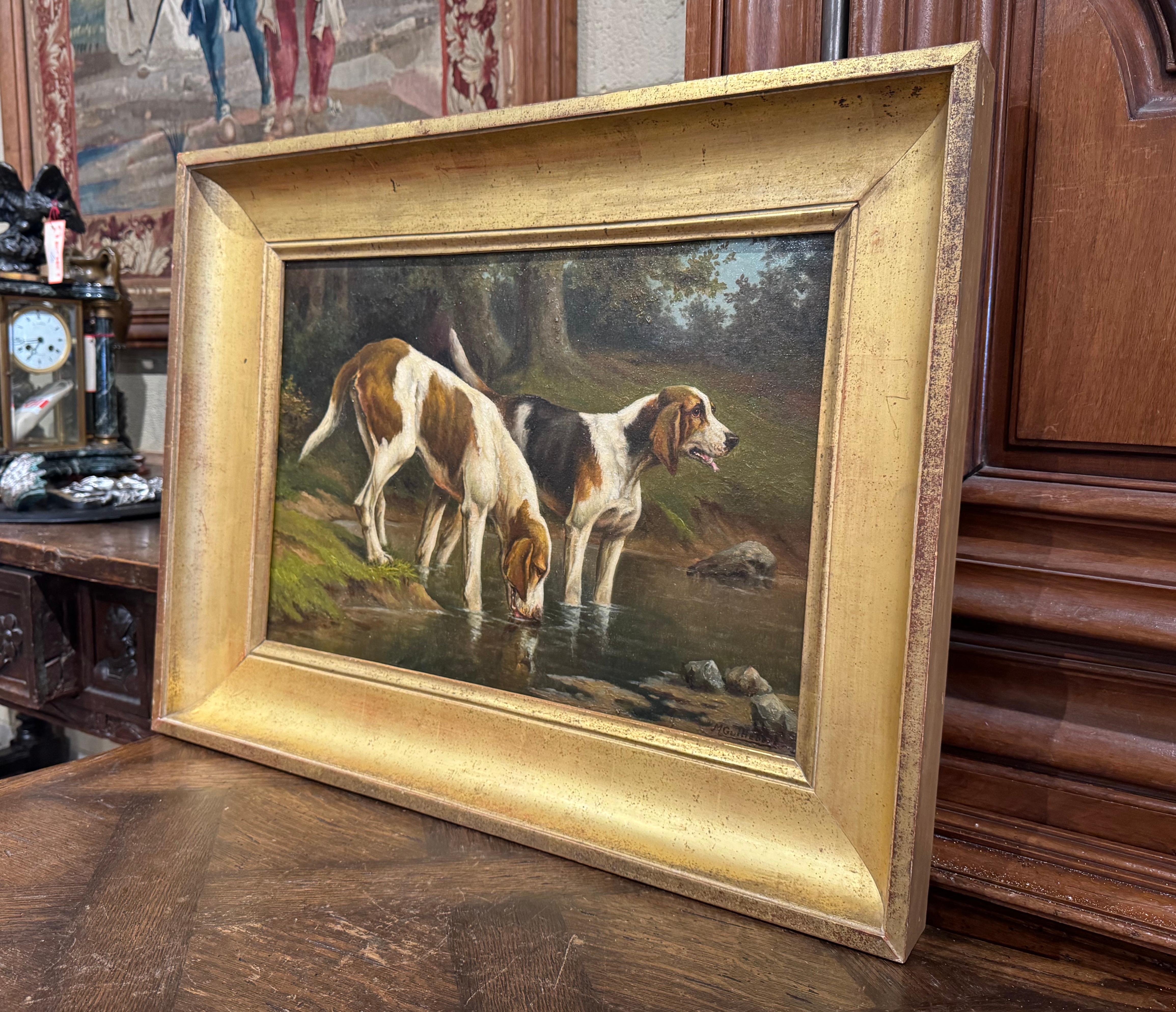 Decorate a study or a den with this colorful antique dog painting. Set in the original carved gilt wood frame, this large painting was created in France circa 1880; the subject composition painted on canvas, depicts two Braques Saint Germain dogs